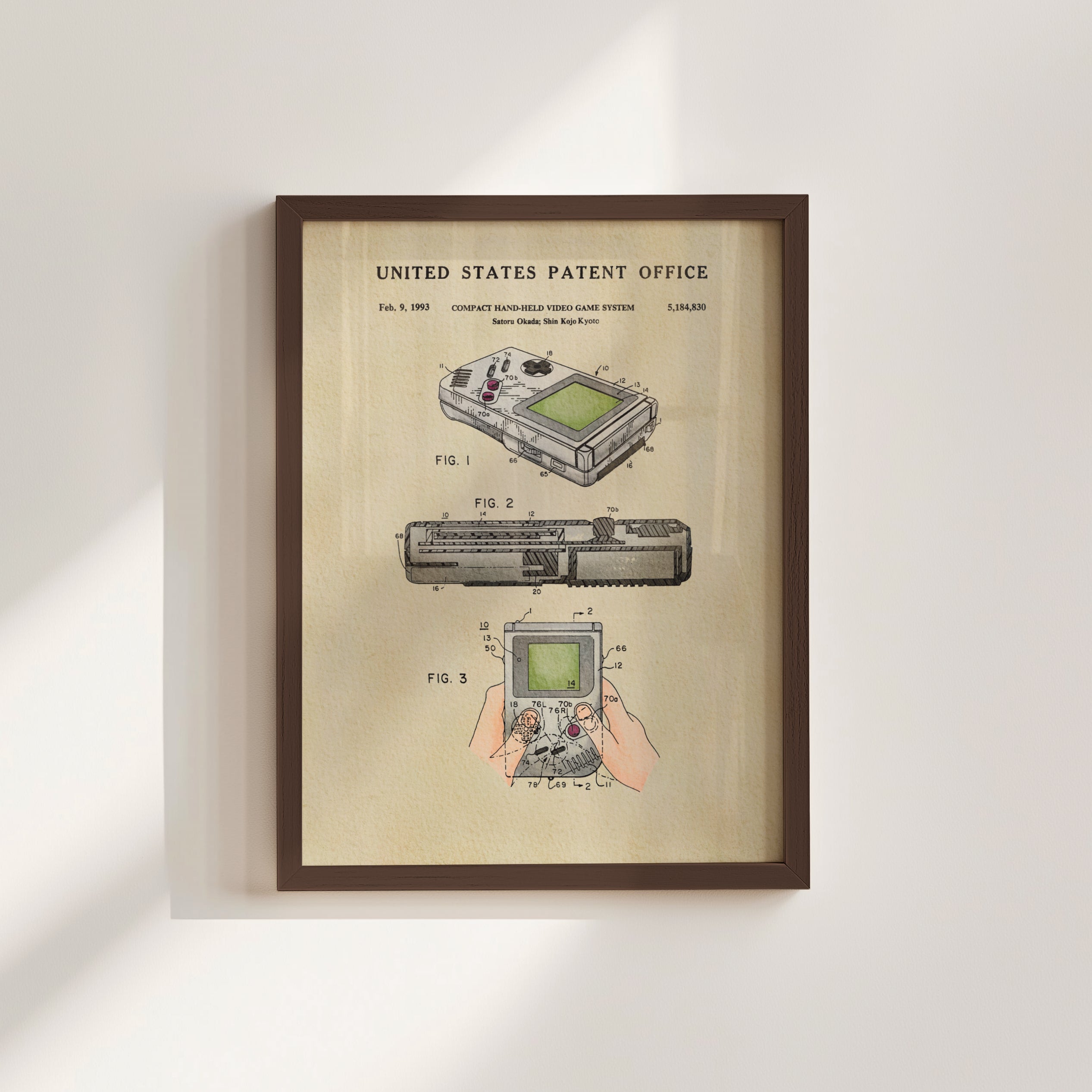 The image is a framed patent illustration depicting the Nintendo Gameboy handheld video game system.