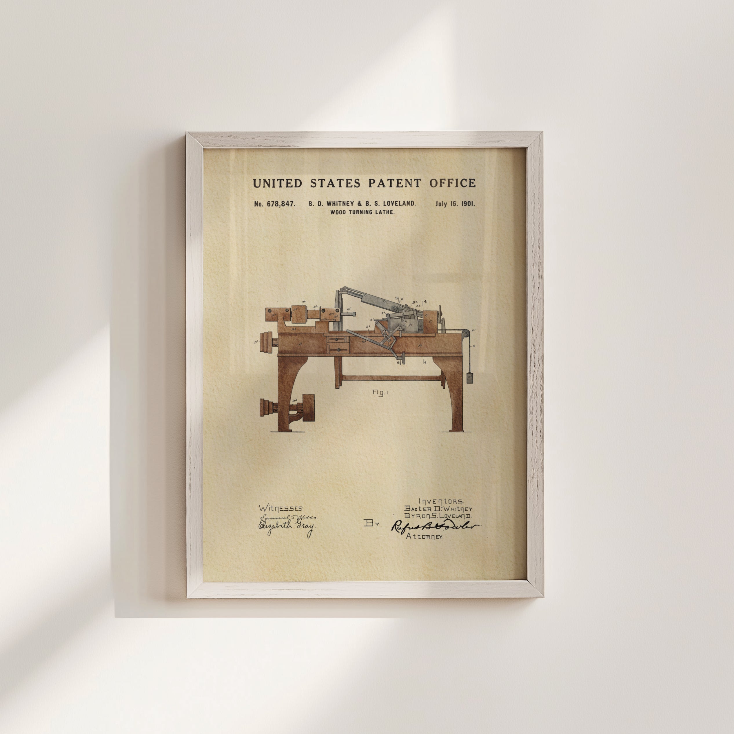 The image is a framed patent drawing of a wooden machine, likely a typewriter, with the United States Patent Office's title and date visible.