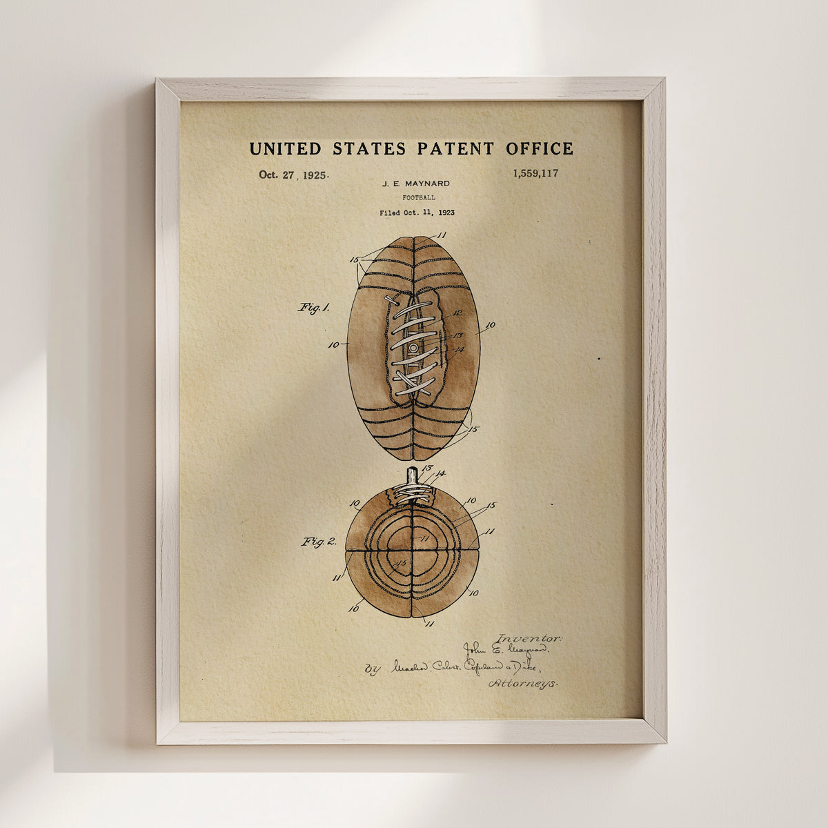 The image is a framed vintage patent drawing depicting a football, with the title "United States Patent Office" and the date "Oct. 27, 1925".