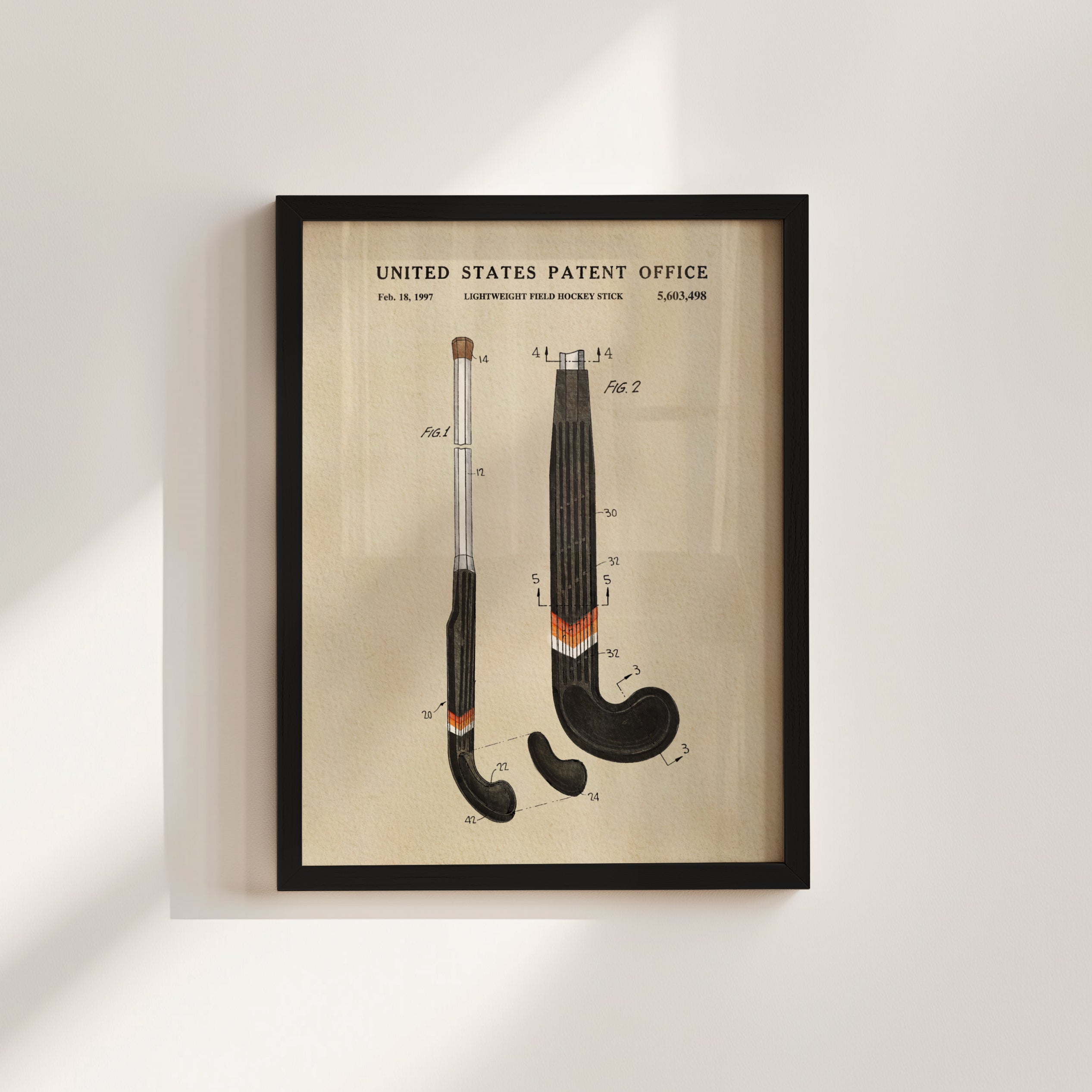 The image is a framed patent drawing depicting two hockey sticks with detailed technical drawings and labels.