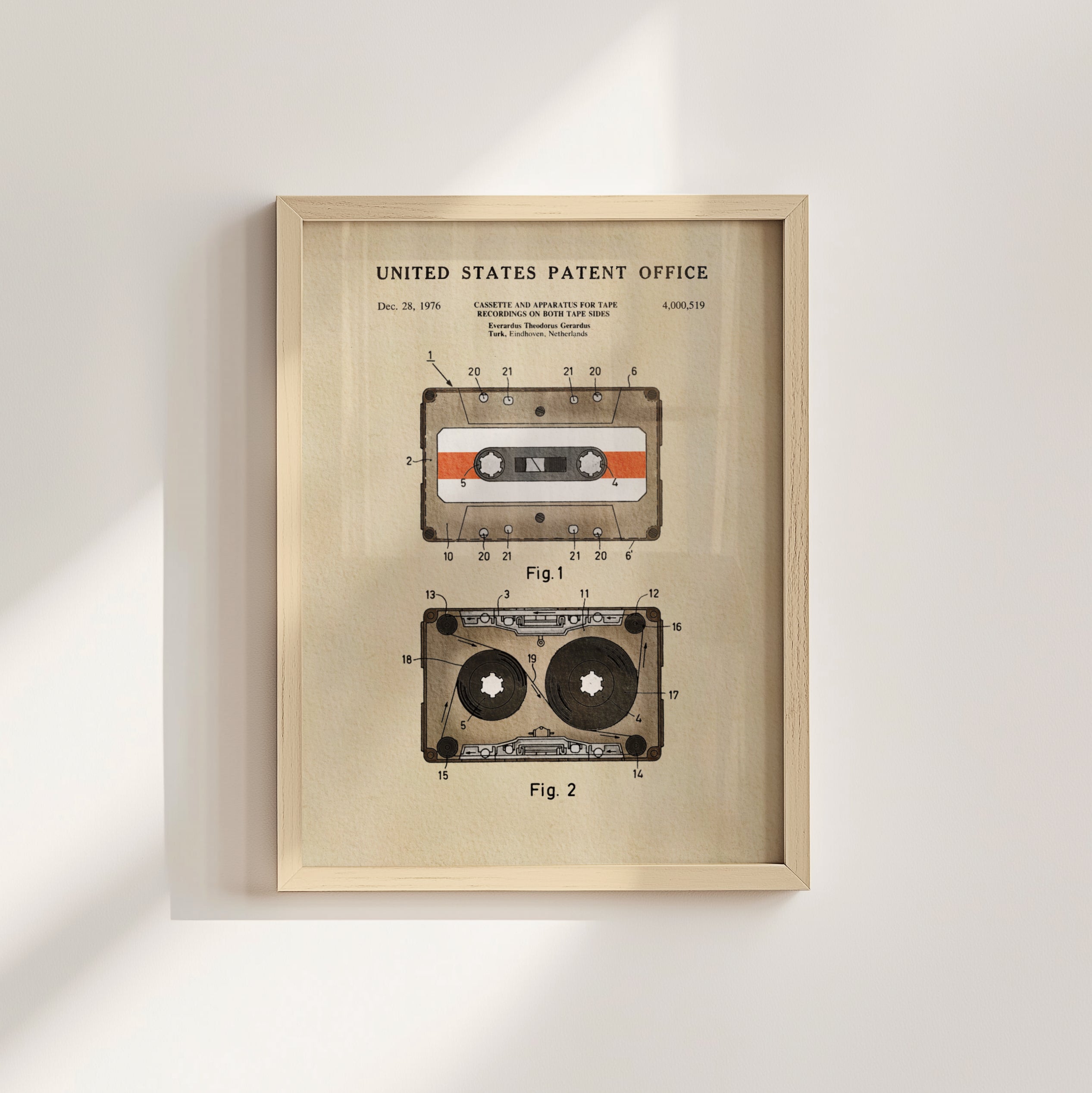 The image is a framed patent drawing depicting a cassette tape with a diagram and text.