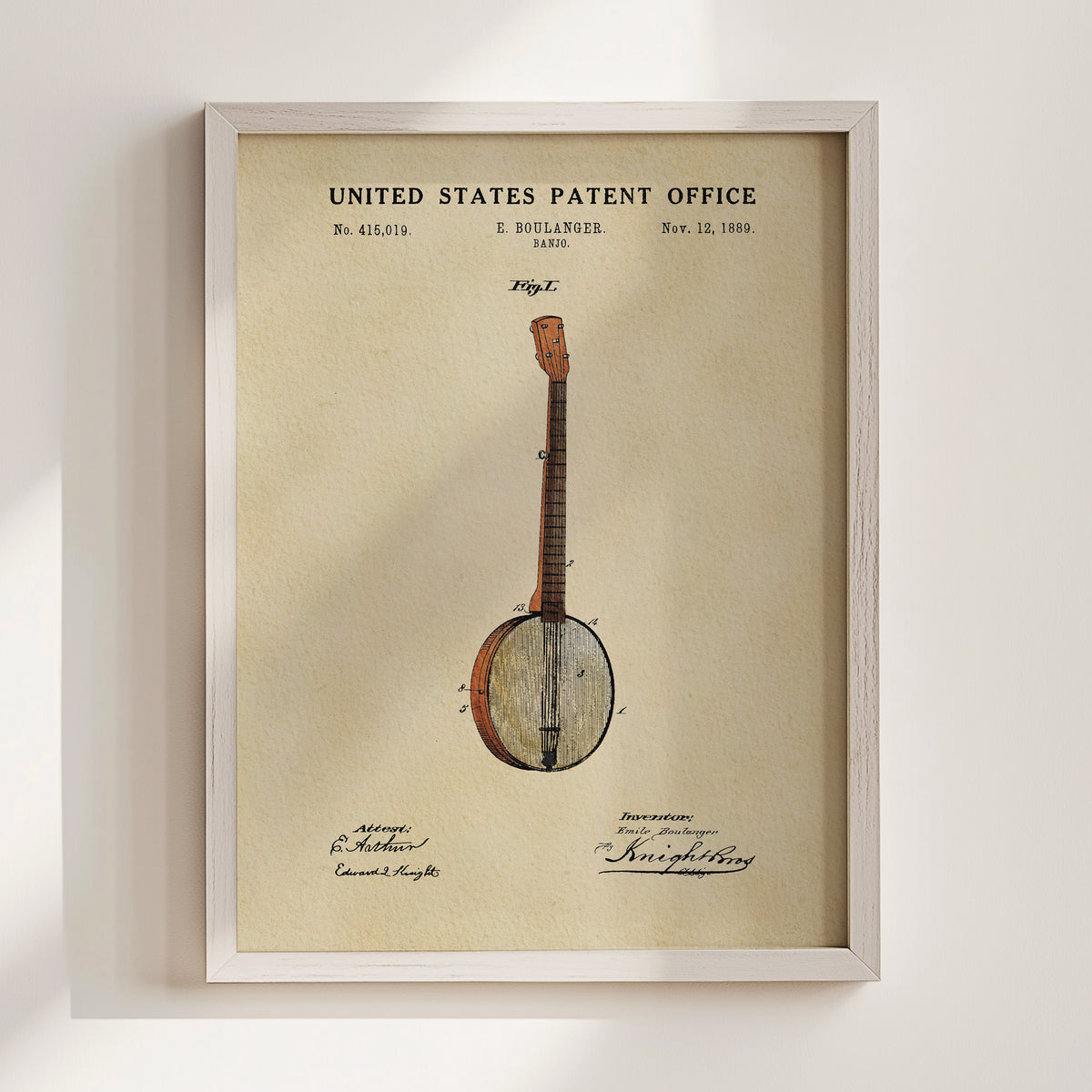 The image is a framed patent drawing of a banjo, depicting a banjo with a wooden body and a round headstock.