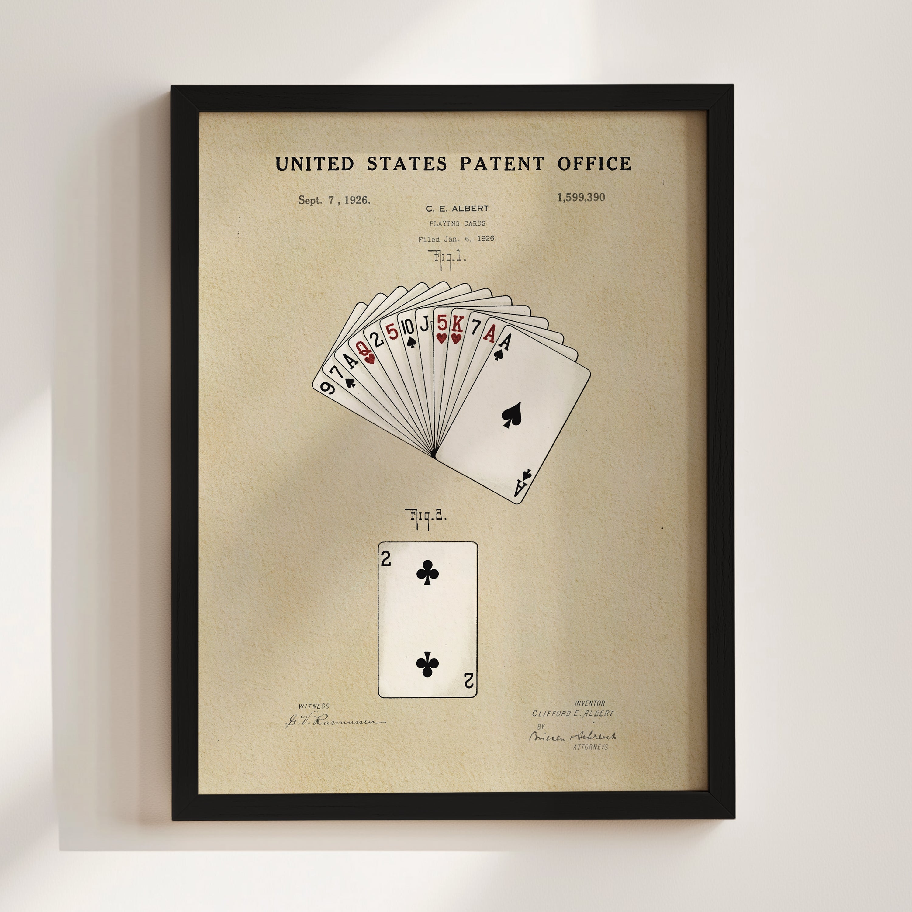 The image is a framed patent drawing depicting a deck of playing cards, specifically showing the ace of spades and the king of hearts.