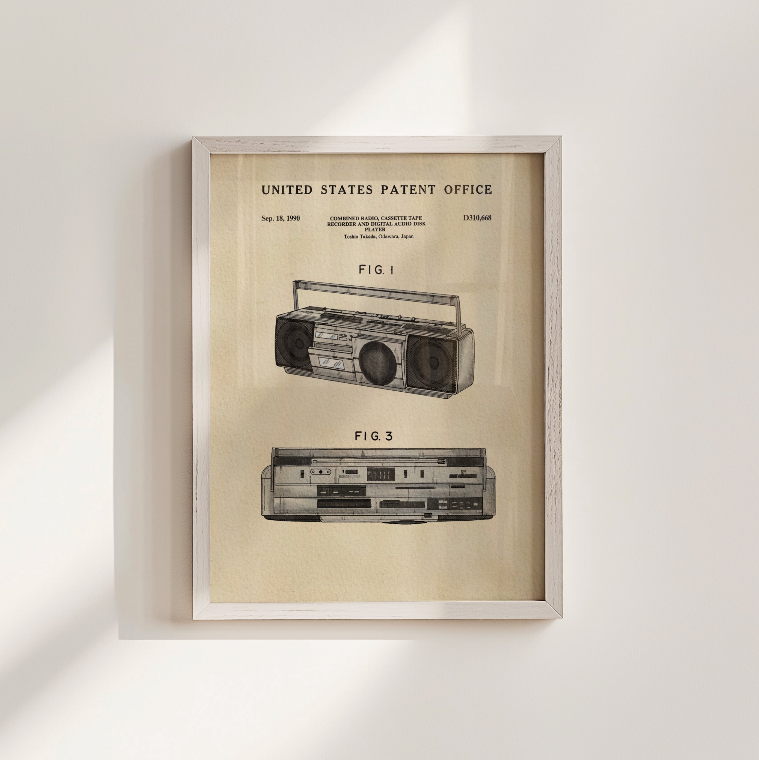The image is a framed patent drawing of a boombox, depicting the design and features of the device.