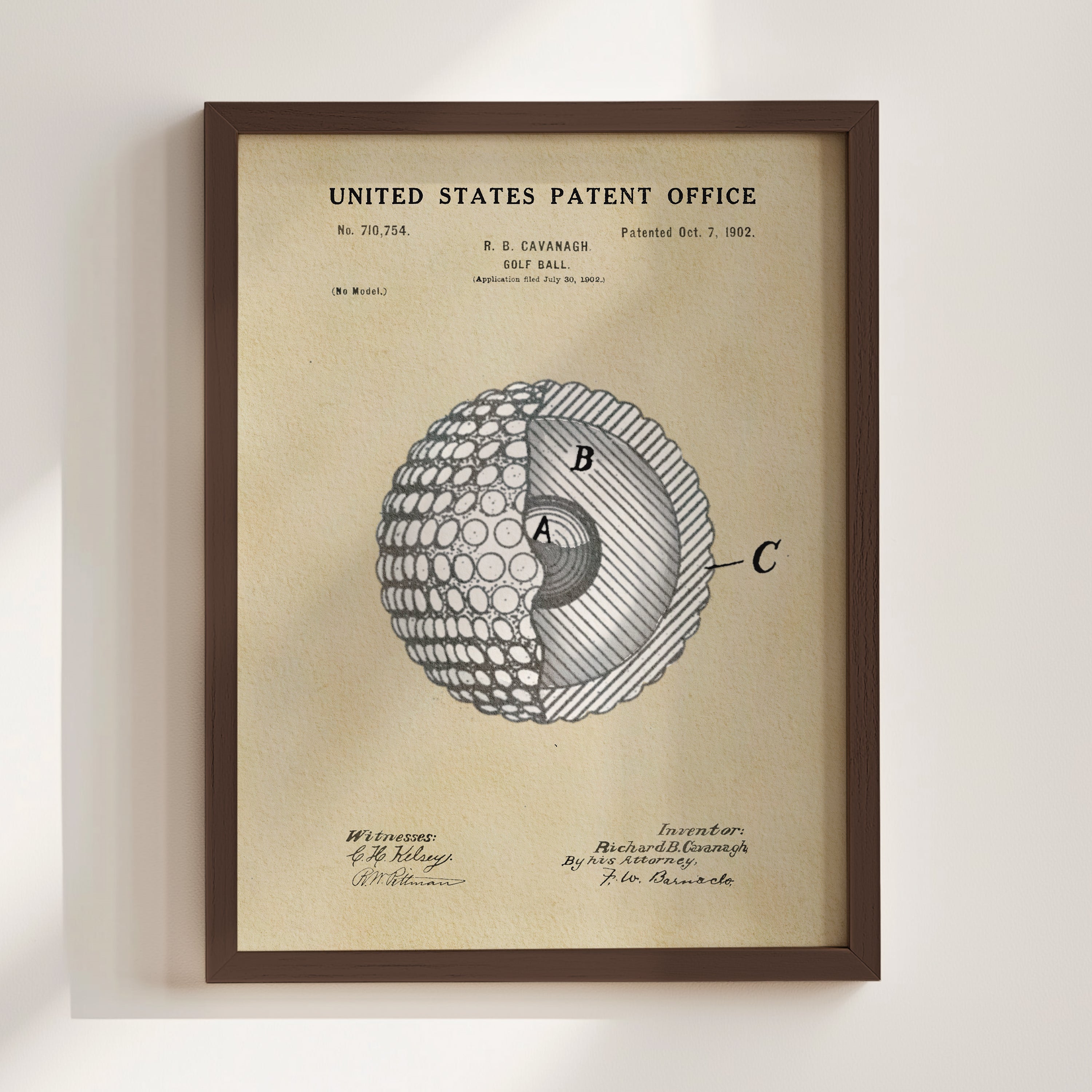 The image is a framed patent drawing depicting a golf ball with a cross-section view, showing the inner structure of the ball.