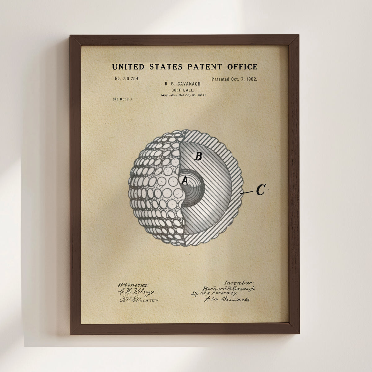 The image is a framed patent drawing depicting a golf ball with a cross-section view, showing the inner structure of the ball.