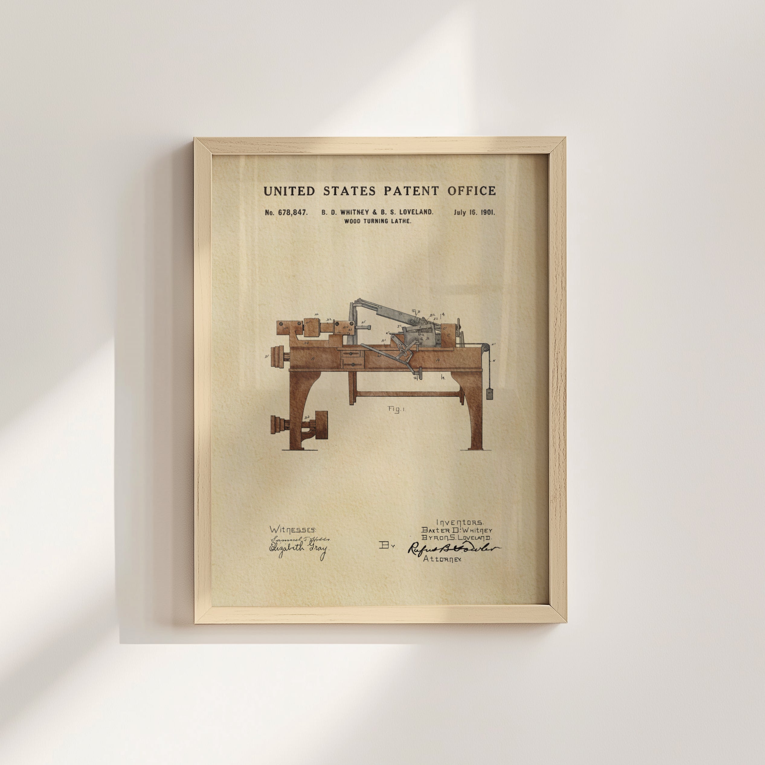 The image is a framed patent drawing depicting a wooden machine with a large wooden frame and a smaller wooden frame.