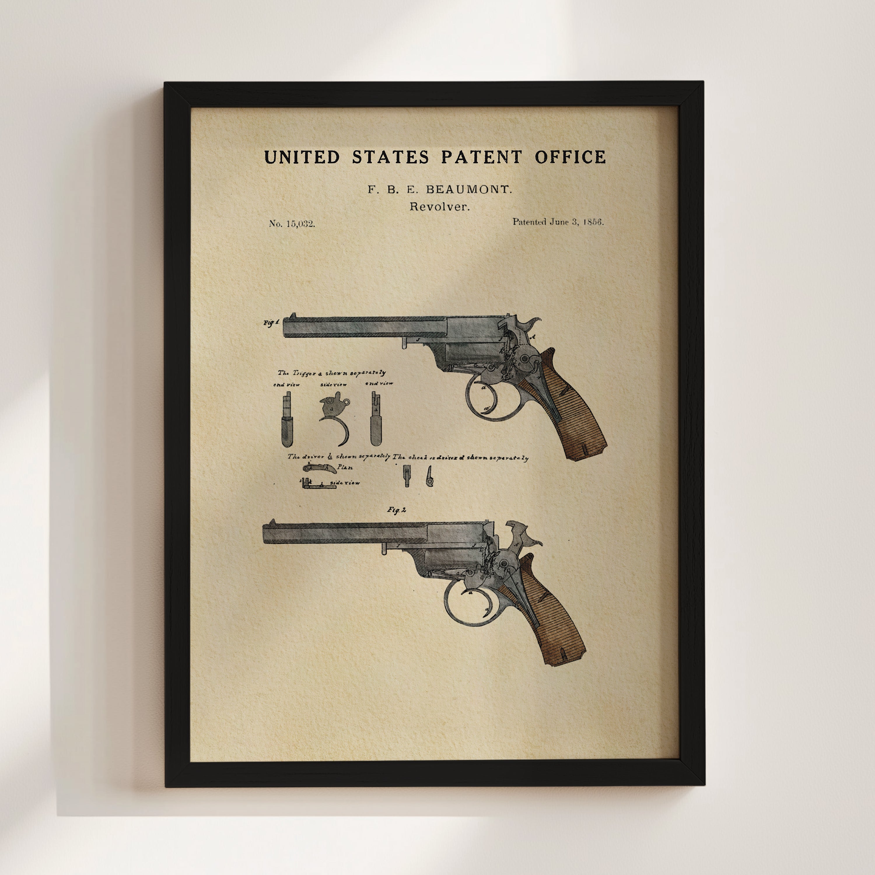 The image is a framed patent drawing of a gun, depicting its design and features.