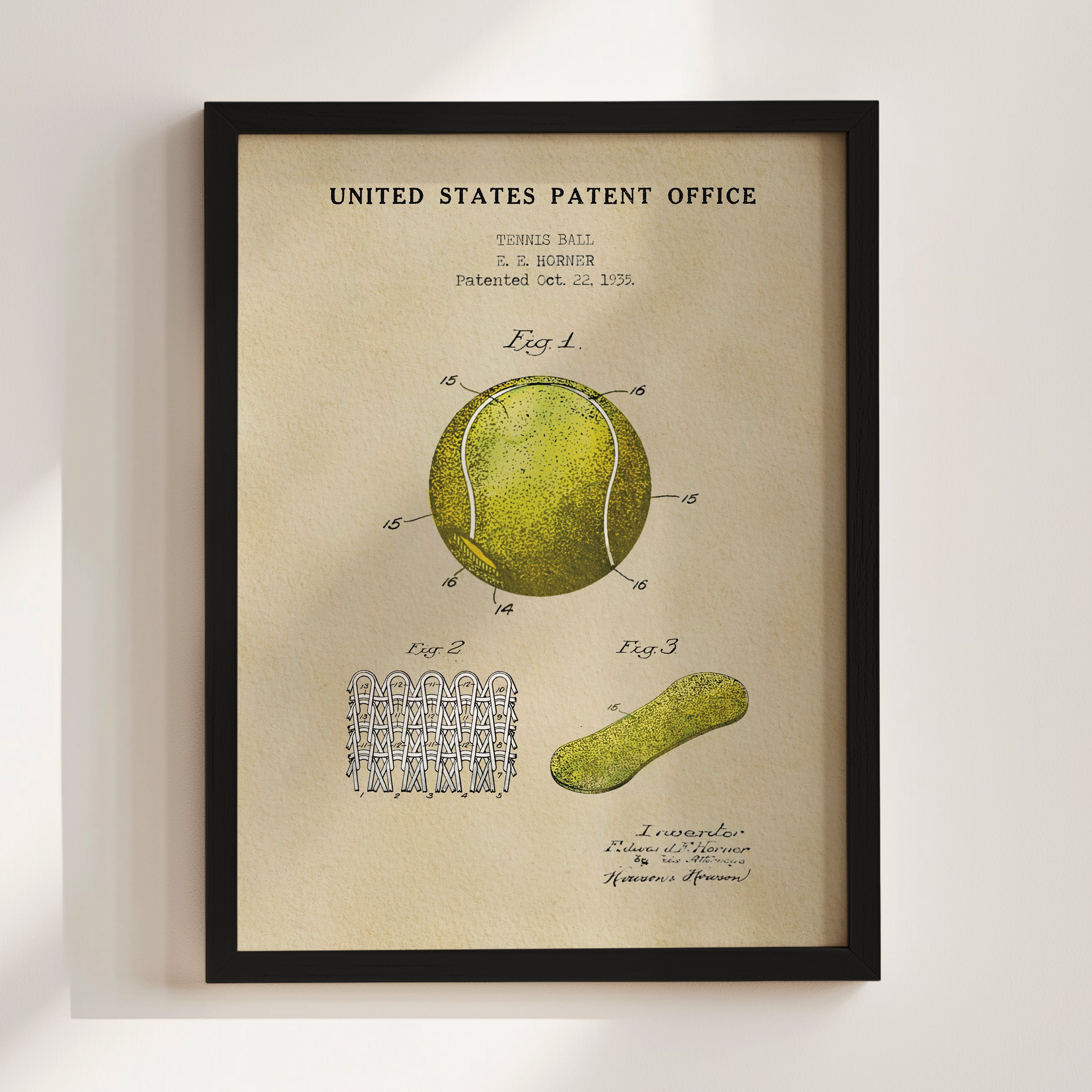 The image is a framed vintage patent drawing of a tennis ball, featuring detailed drawings and technical specifications.