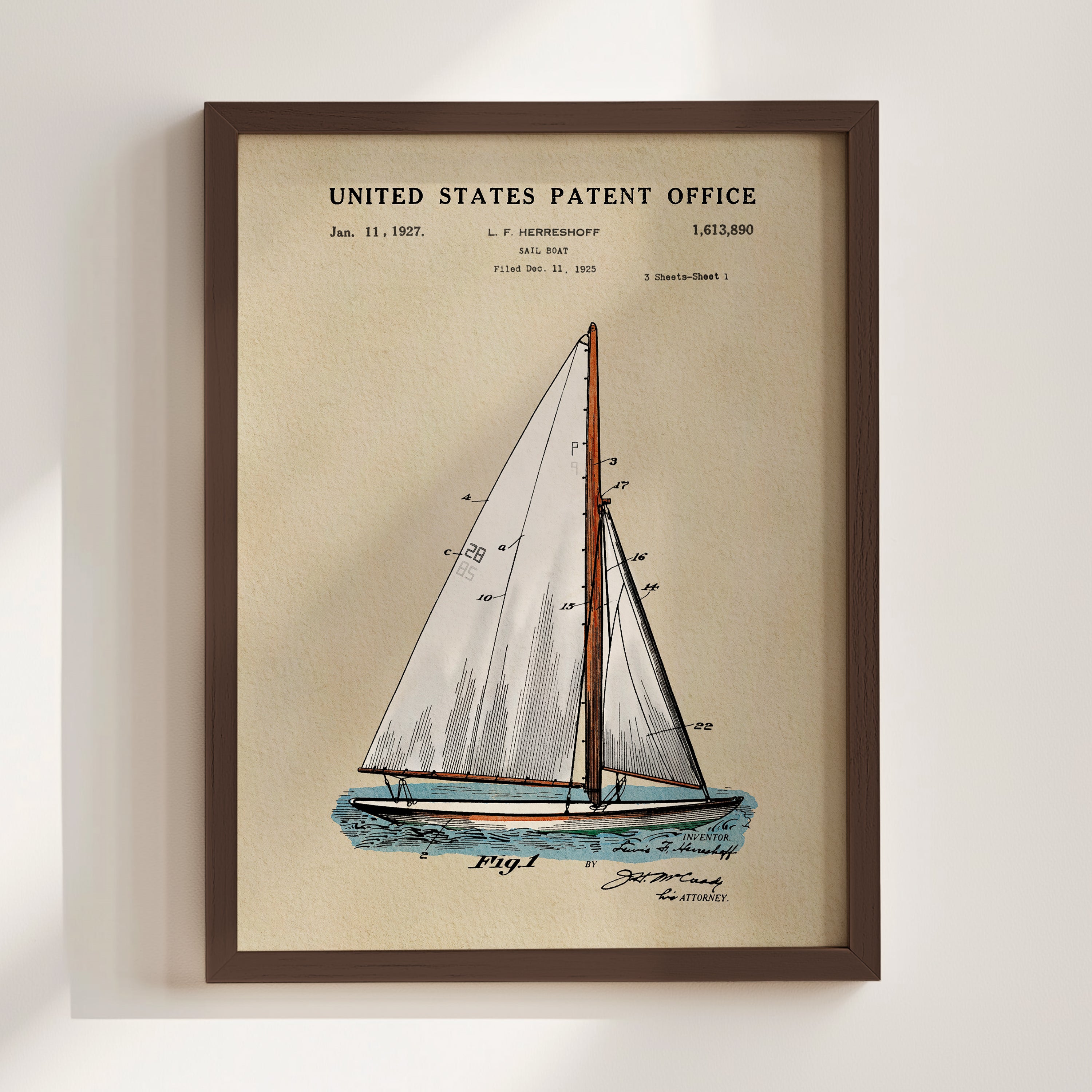 A framed print of a sailboat with a United States patent office sign in the background.