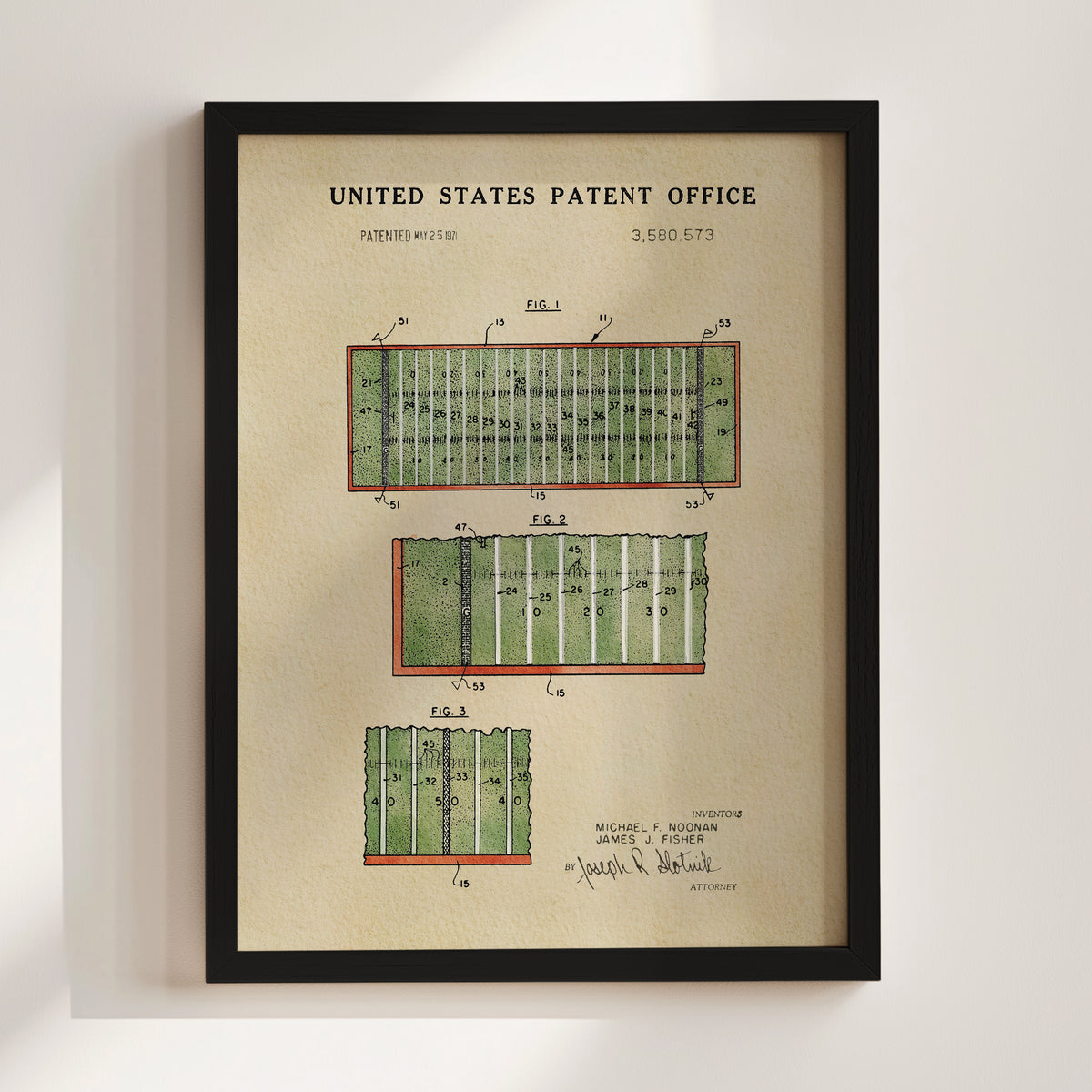 The image is a framed print of a United States patent office patent filing, featuring a detailed illustration of a football field with various markings and dimensions.