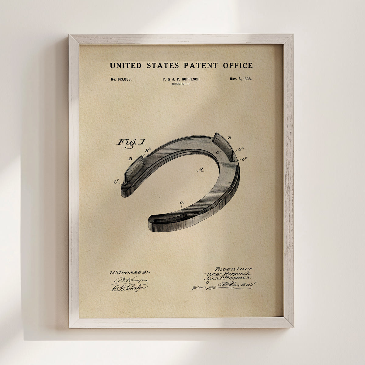 The image is a framed vintage patent drawing of a horseshoe, depicting the design and construction of the horseshoe.