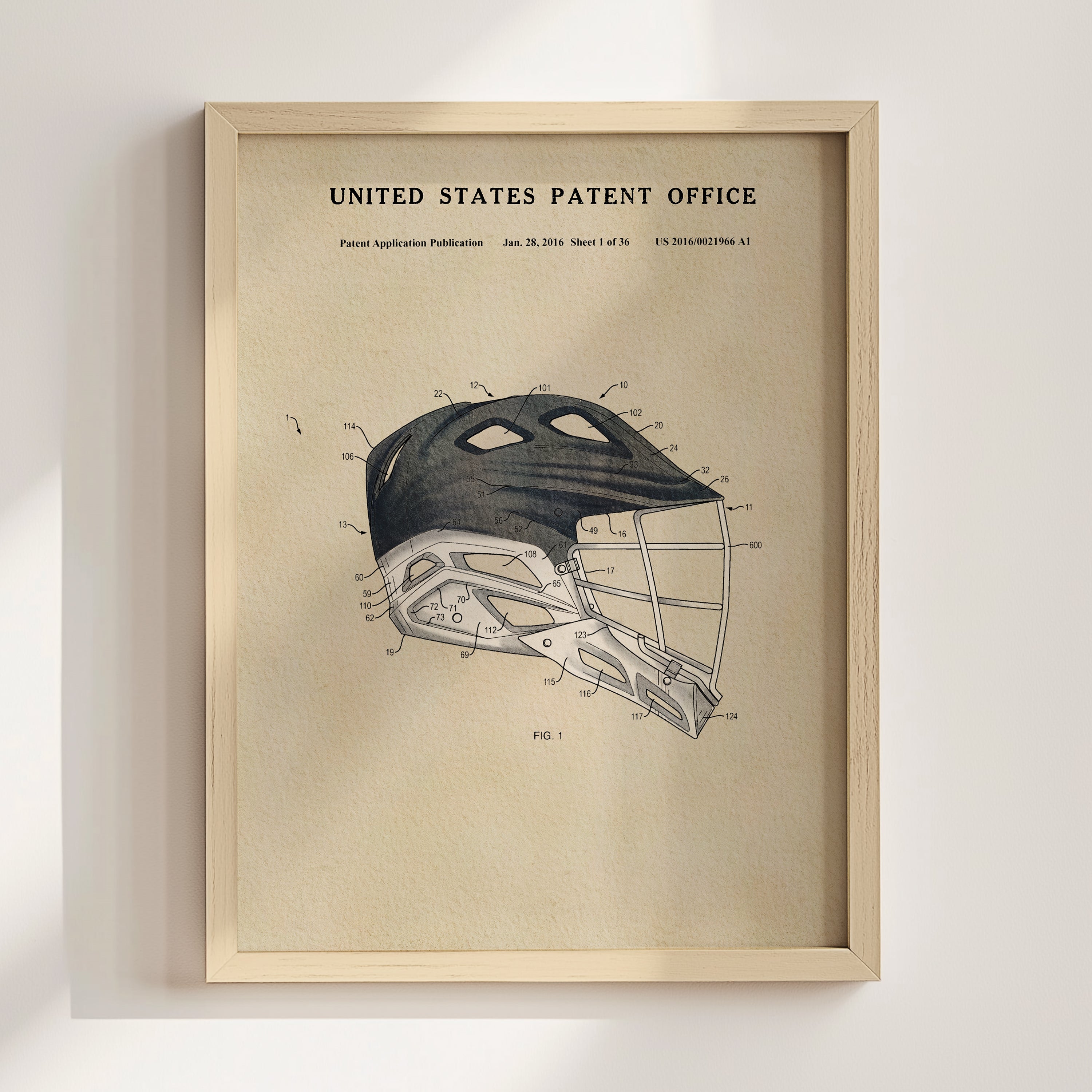 The image is a framed poster or print featuring a detailed technical drawing or diagram of a sports helmet, likely intended for use in the United States Patent Office.
