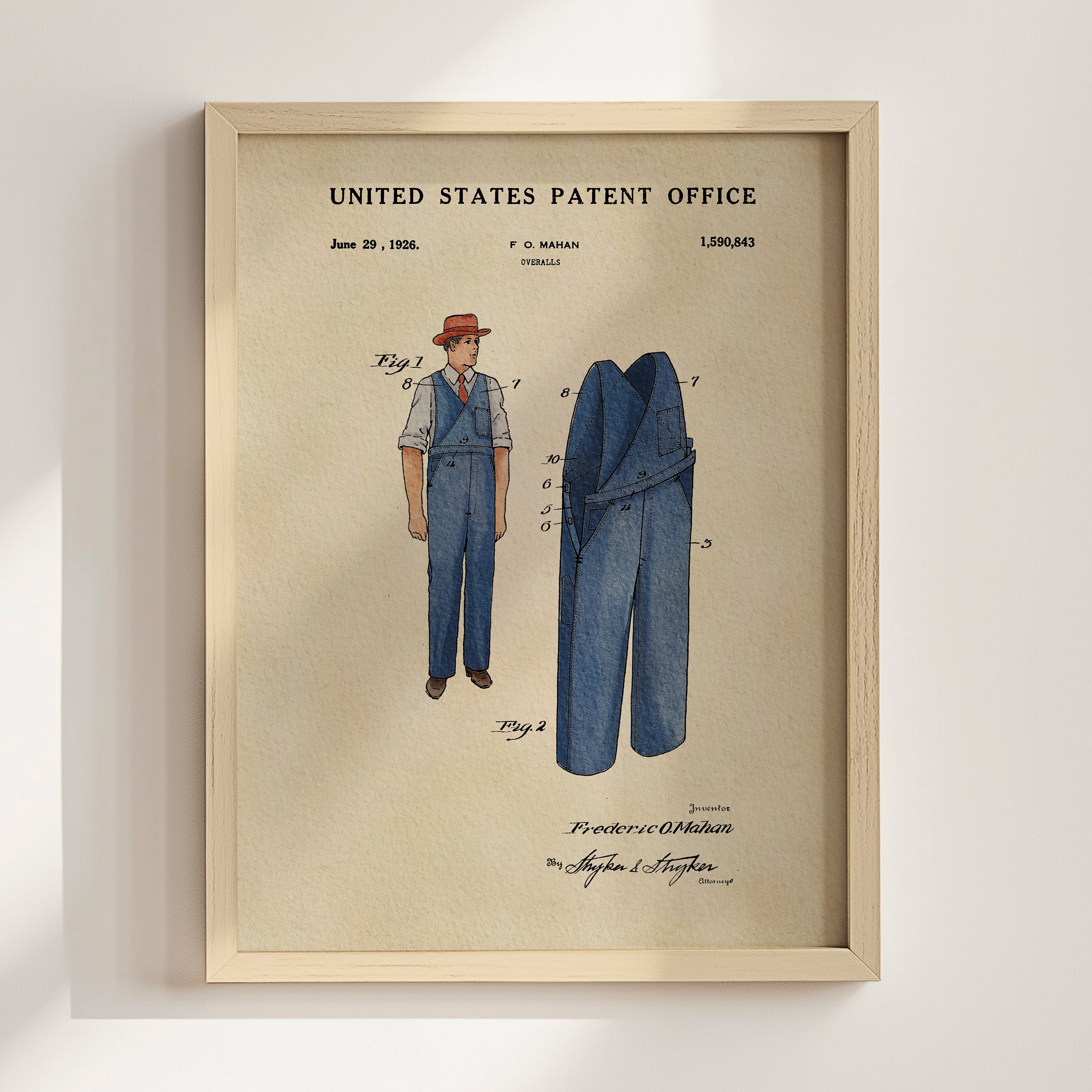 The image is a framed patent drawing depicting a man's outfit, including a hat and pants, with a focus on the design and construction of the clothing.