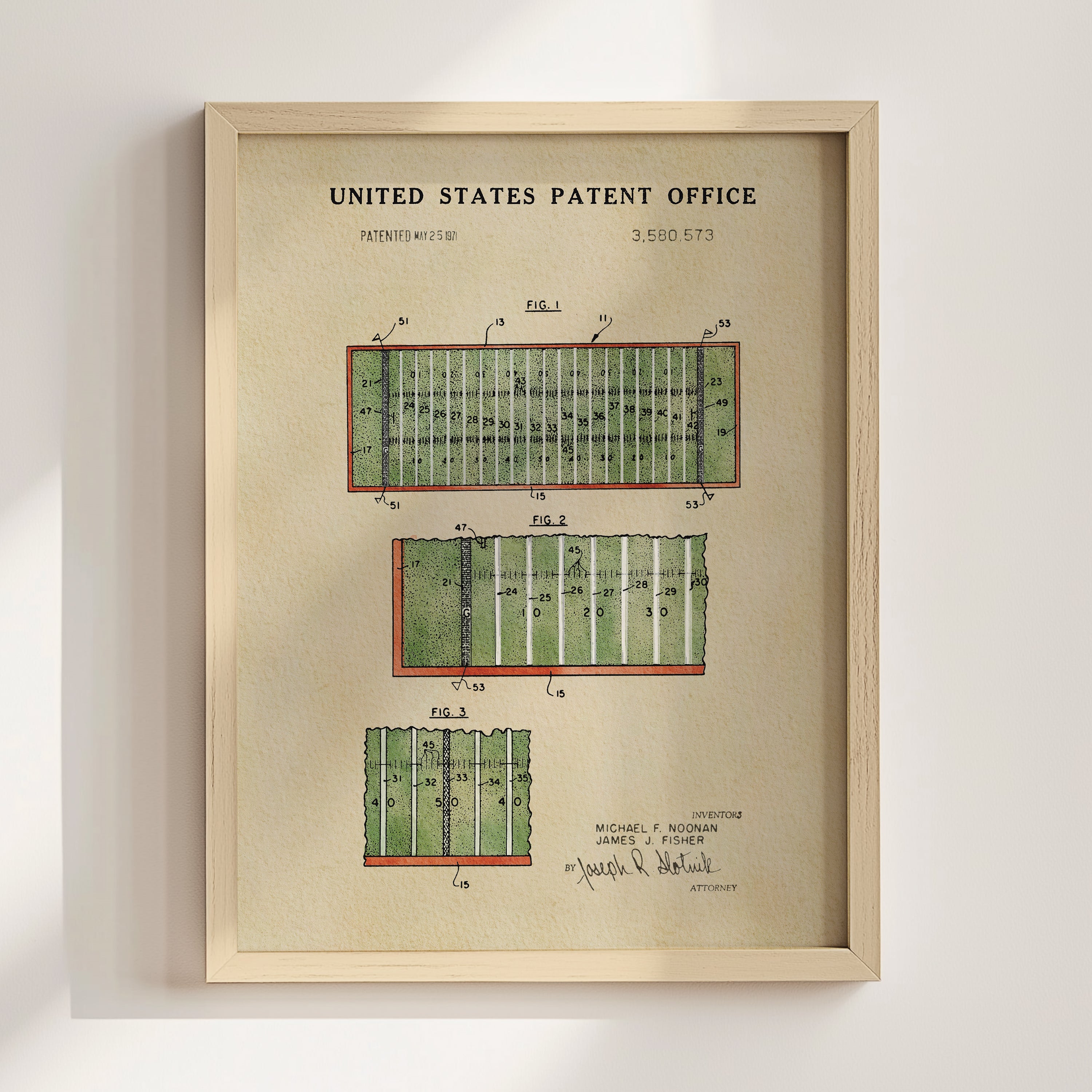 The image is a framed print of a United States patent office patent filing, featuring a detailed illustration of a football field with various markings and dimensions.