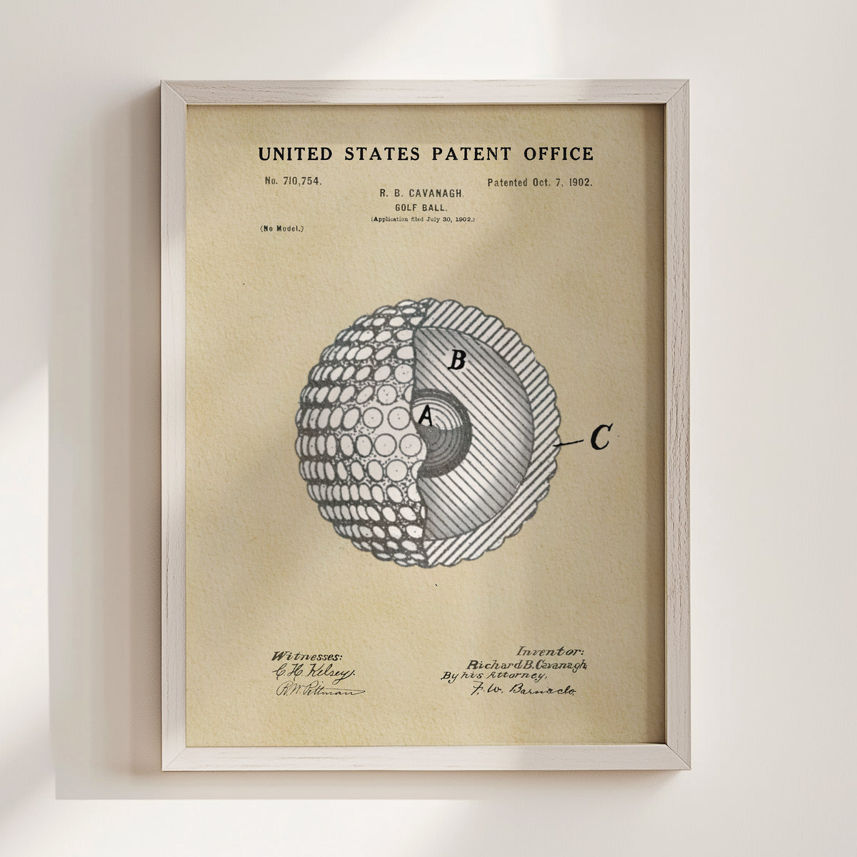 The image is a framed patent drawing depicting a golf ball with a cross-section view, showing the inner structure of the ball.