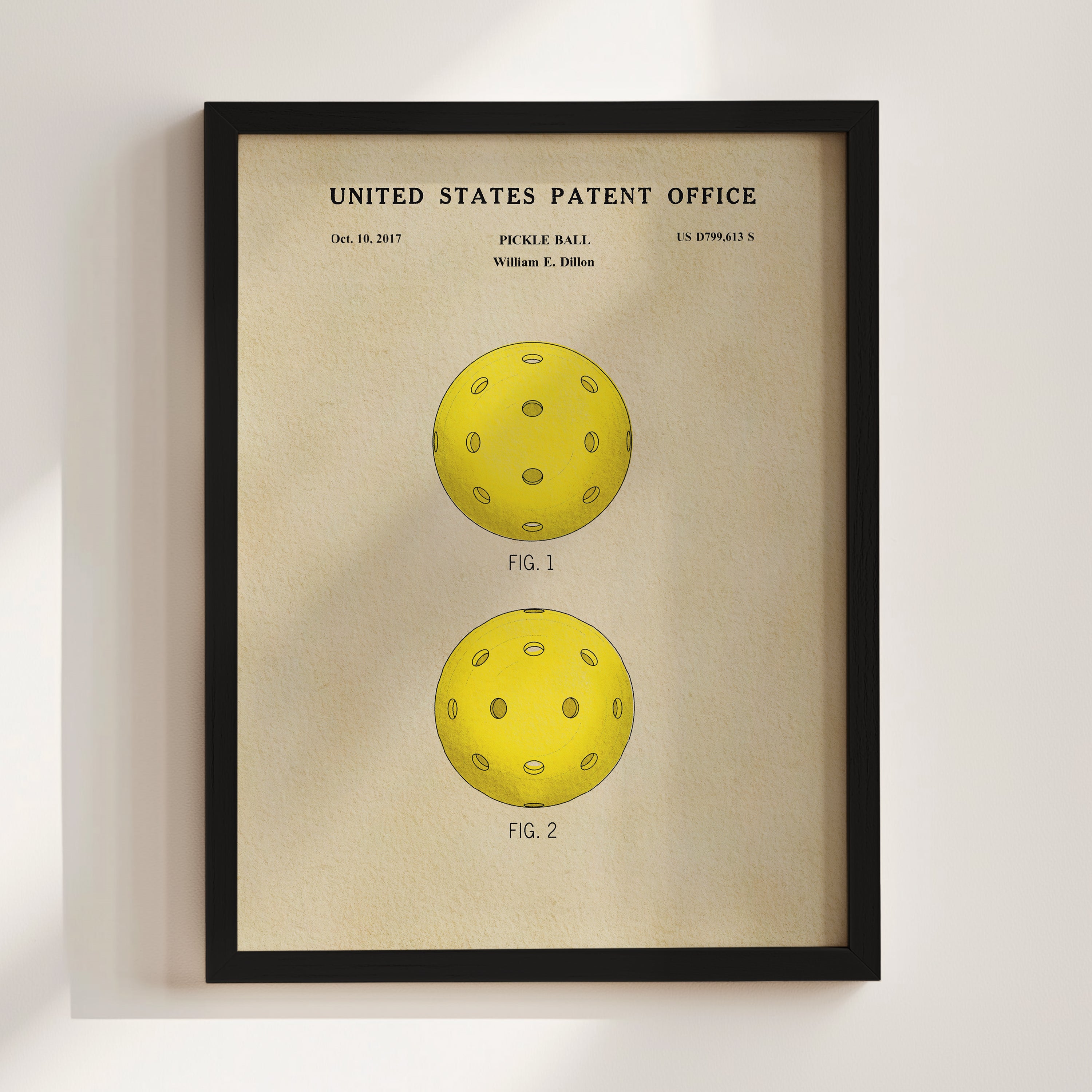 The image is a framed print of a patent application for a paddle ball, featuring two illustrations of the paddle ball design.