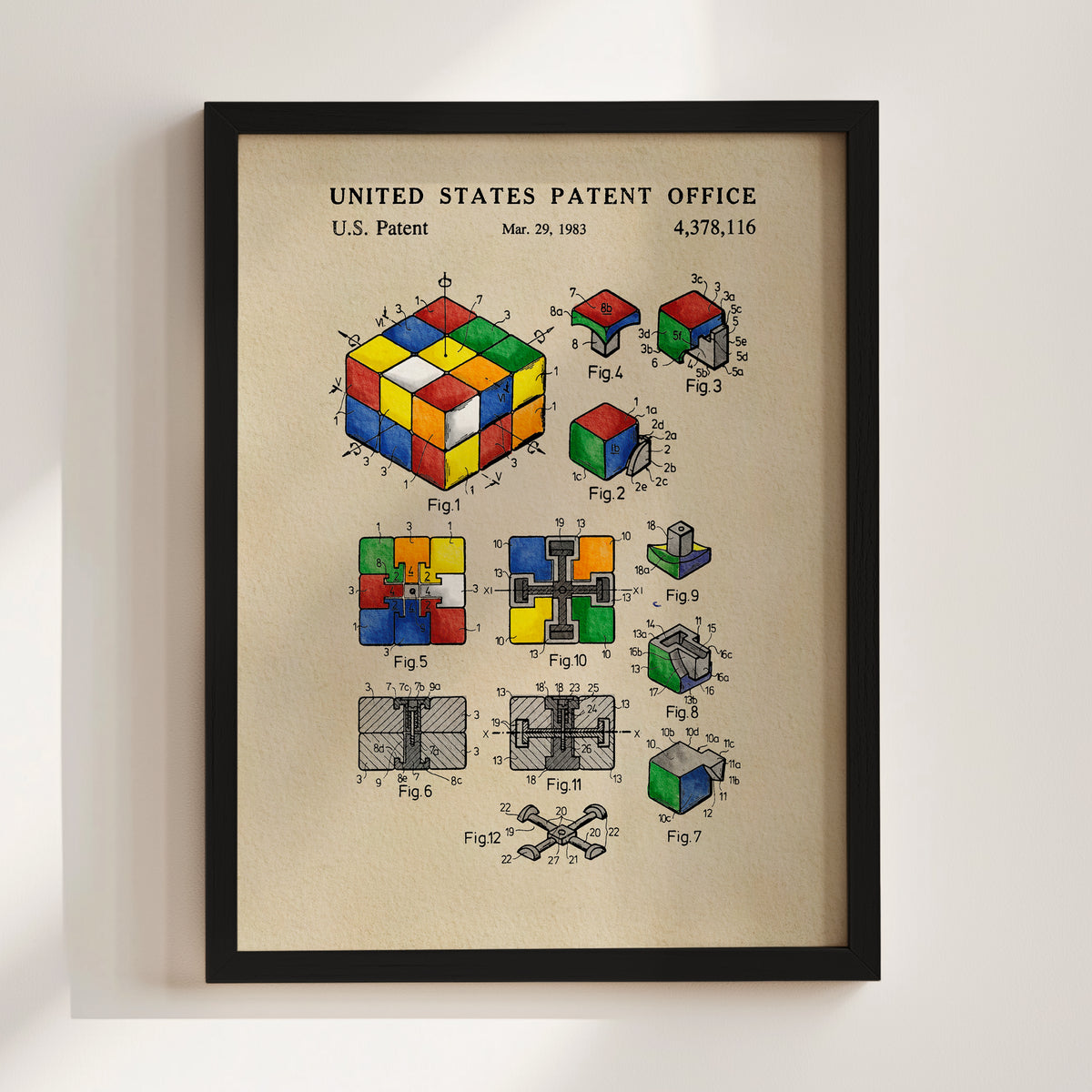 The image is a framed patent drawing depicting a Rubik's cube and its various components, including the cube itself and its internal mechanisms.