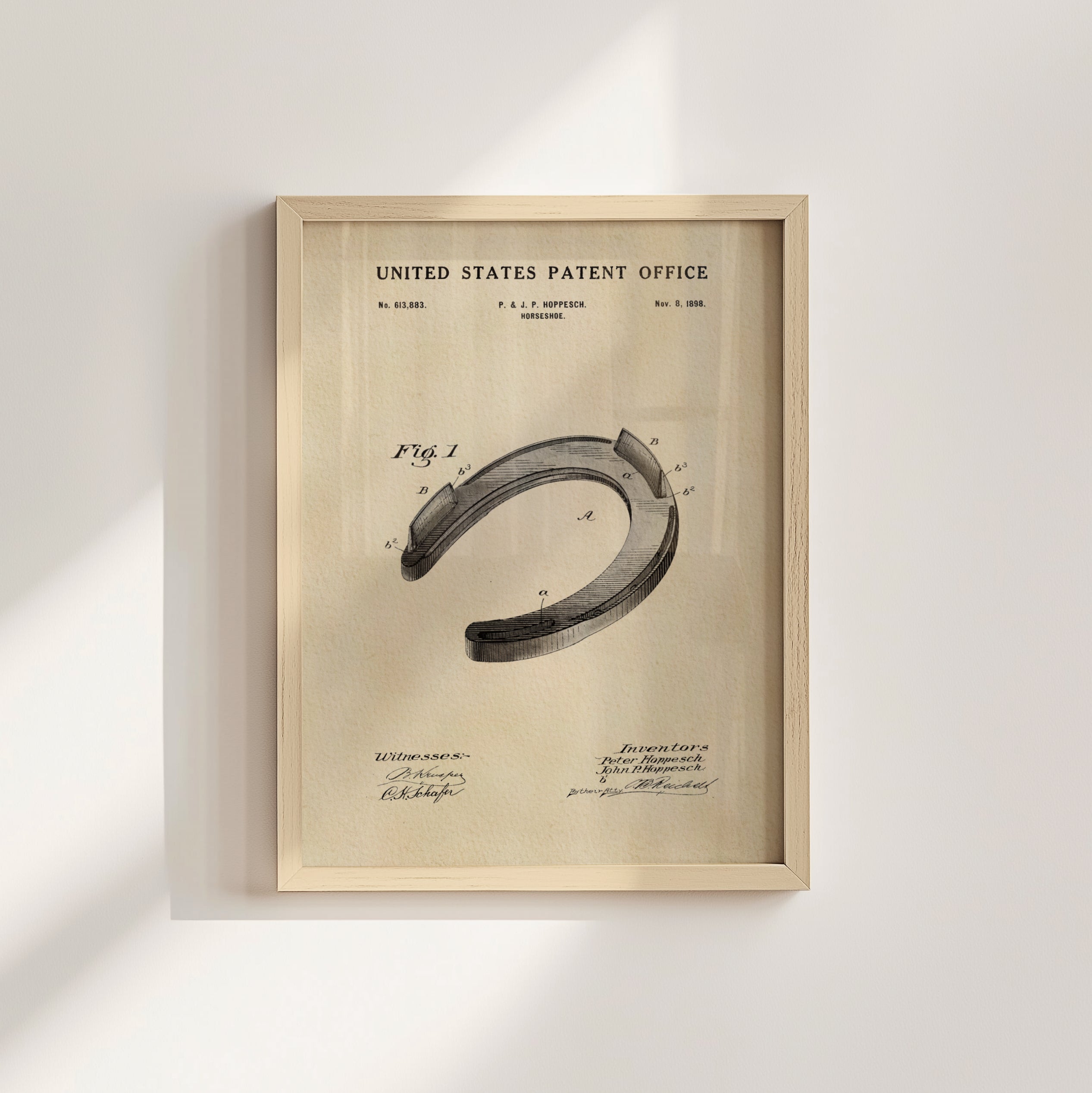The image is a framed patent drawing of a horseshoe, depicting the design and features of the horseshoe.