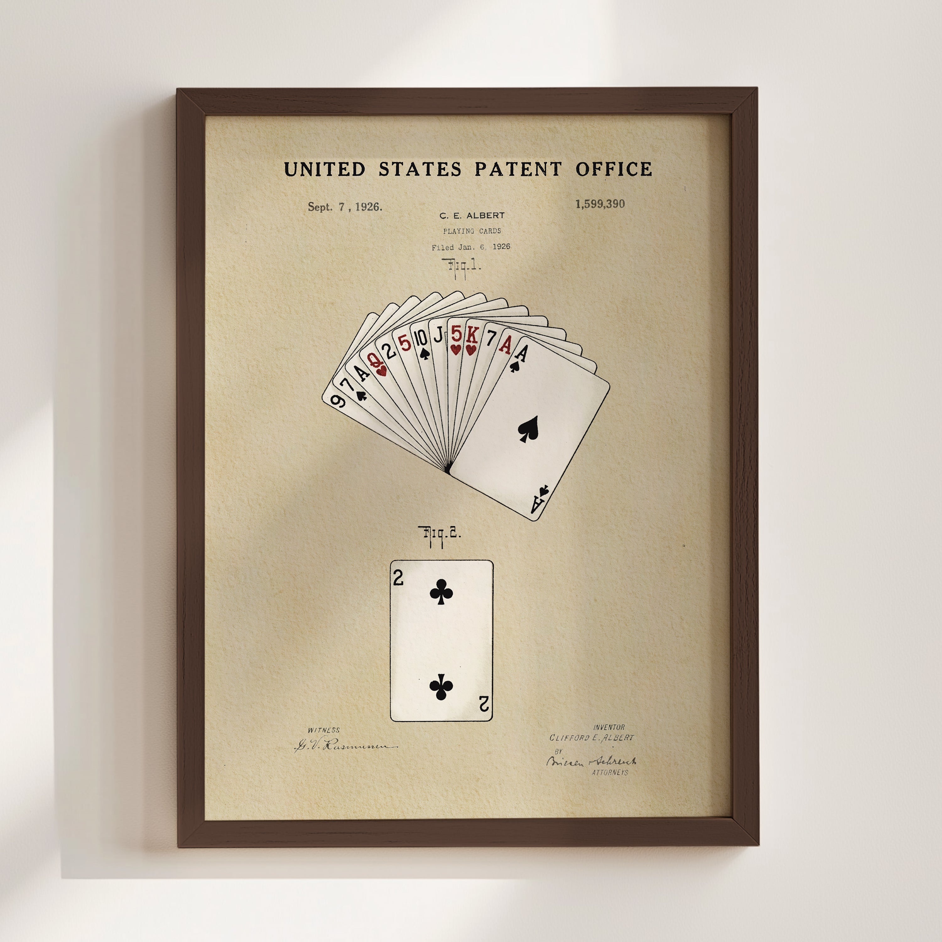 The image is a framed patent drawing depicting a deck of playing cards, specifically showing the ace of spades and the king of hearts.