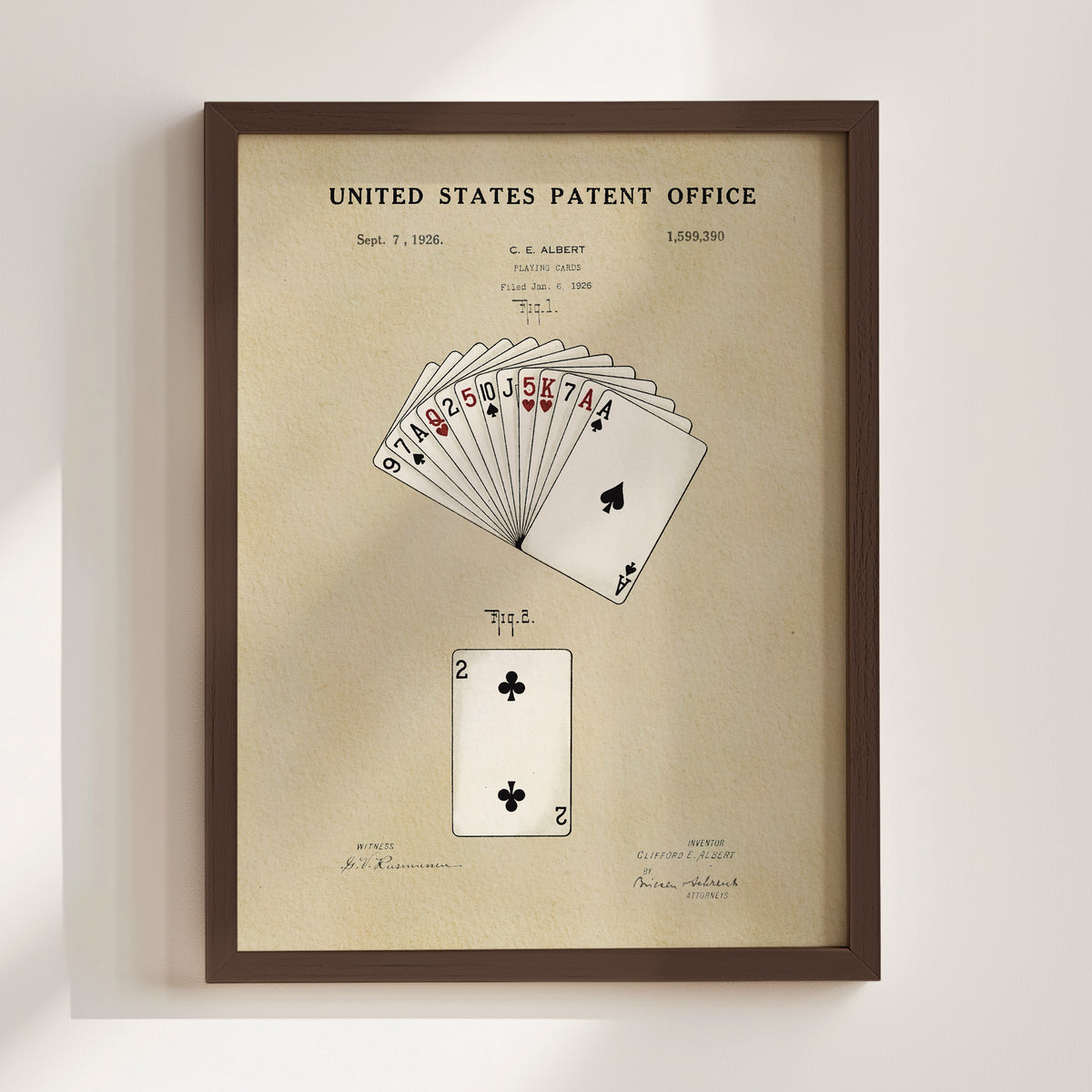 The image is a framed patent drawing depicting a deck of playing cards, specifically showing the ace of spades and the king of hearts.