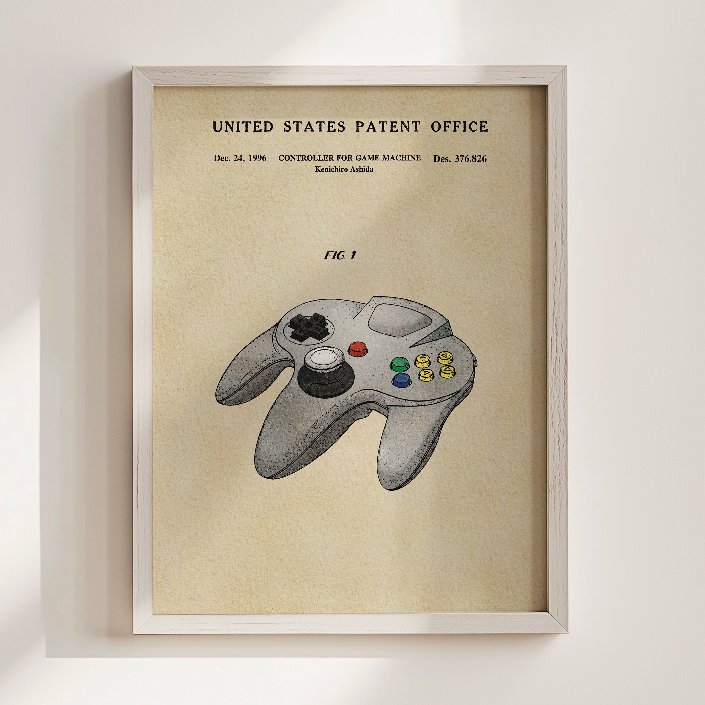 The image is a framed poster or painting depicting a Nintendo 64 game controller, specifically the F1, with the United States Patent Office's patent information displayed above it.