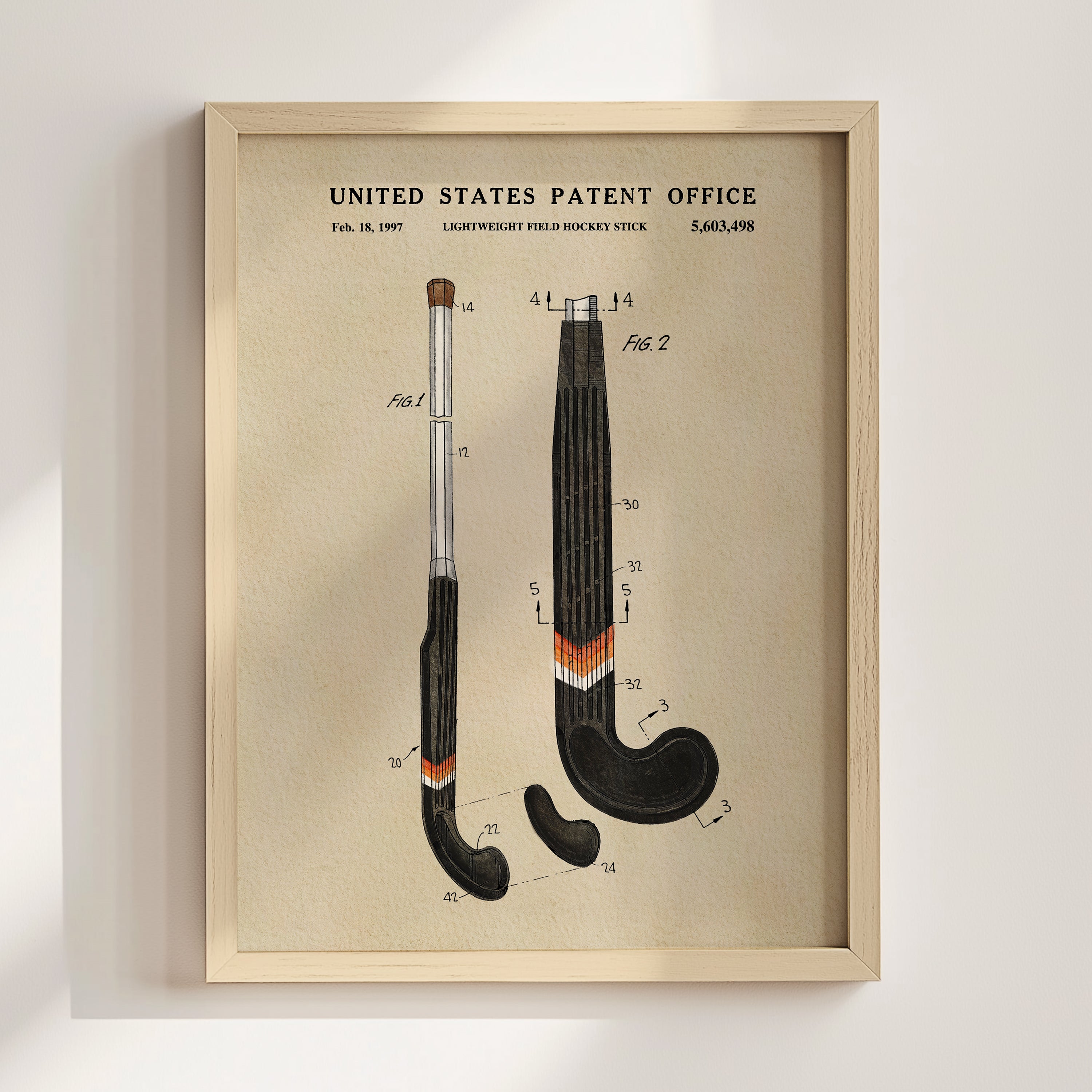The image is a framed patent drawing depicting a hockey stick with detailed technical drawings and measurements.