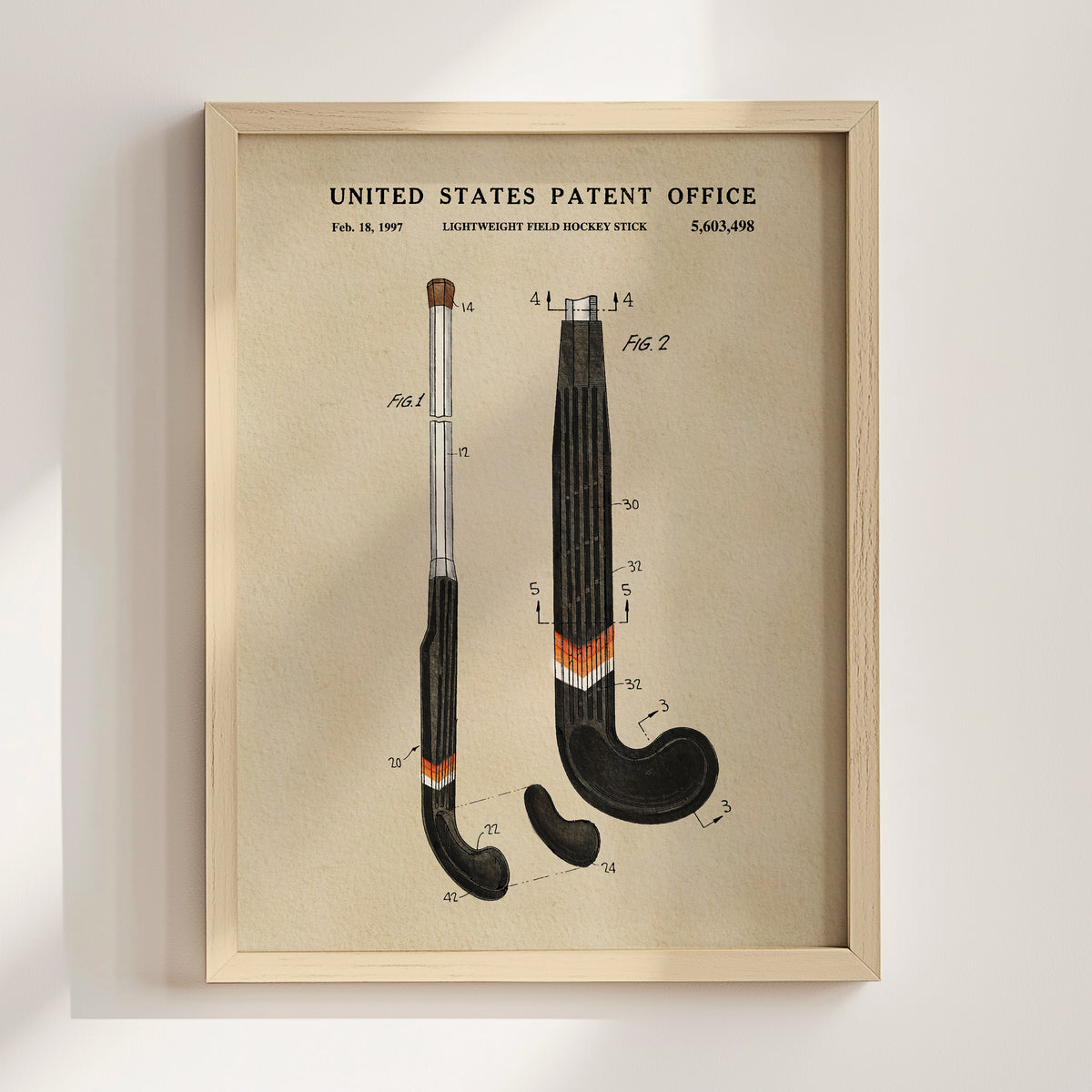 The image is a framed patent drawing depicting a hockey stick with detailed technical drawings and measurements.