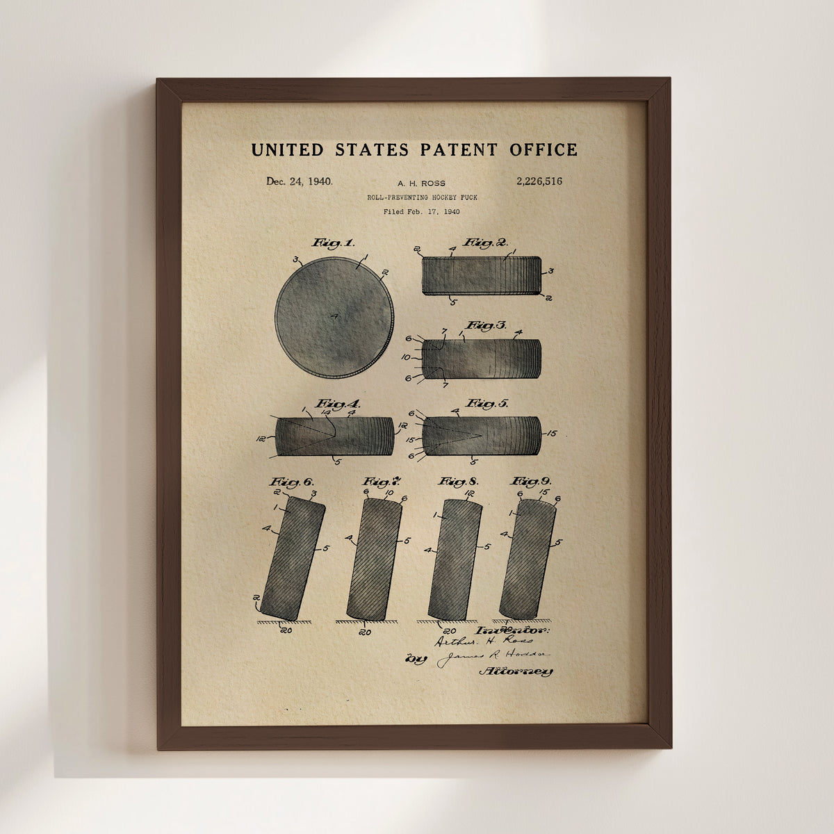 The image is a framed patent drawing from the United States Patent Office, depicting a round object with various geometric shapes surrounding it.