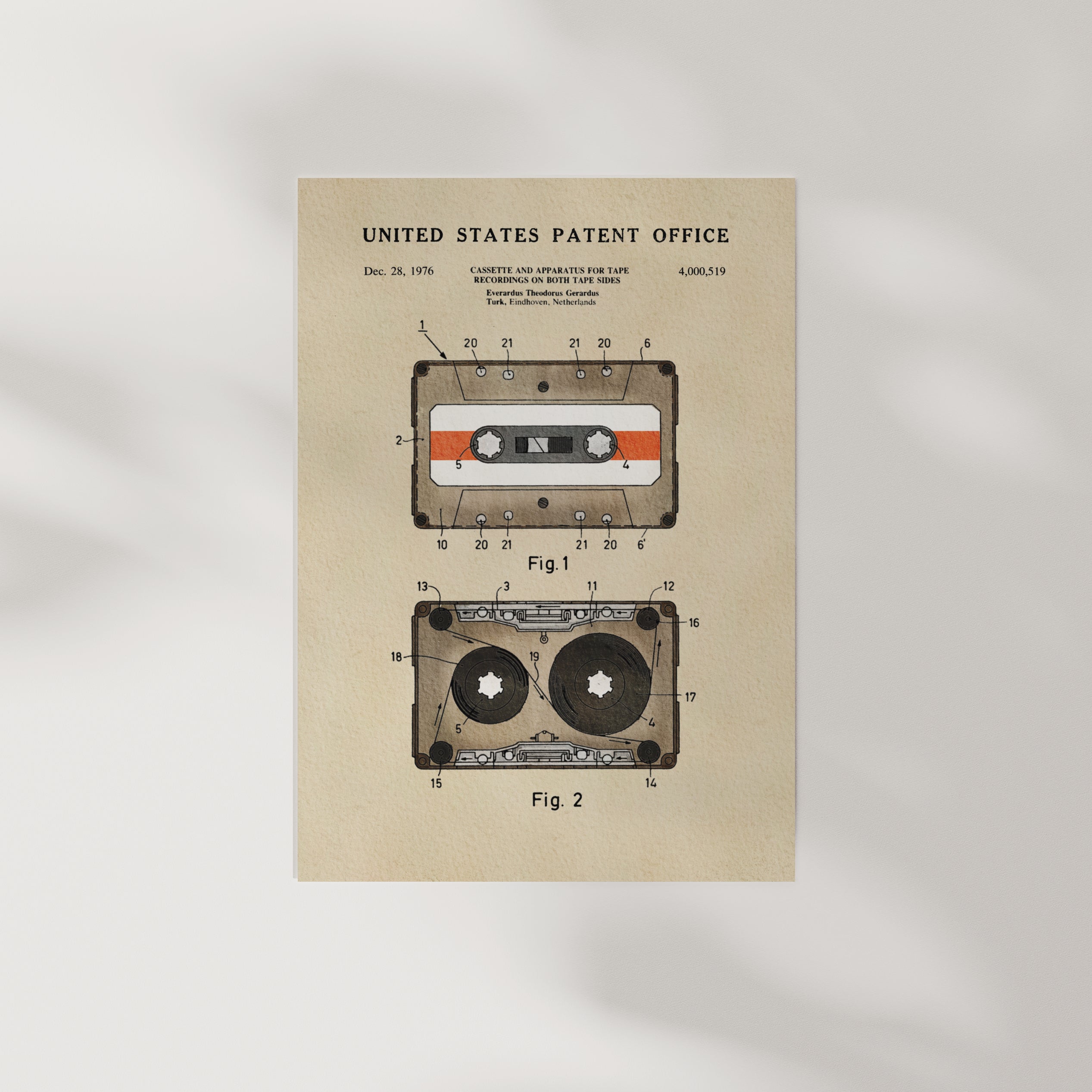 The image is a vintage patent drawing of a cassette tape, depicting the design and features of a cassette tape.