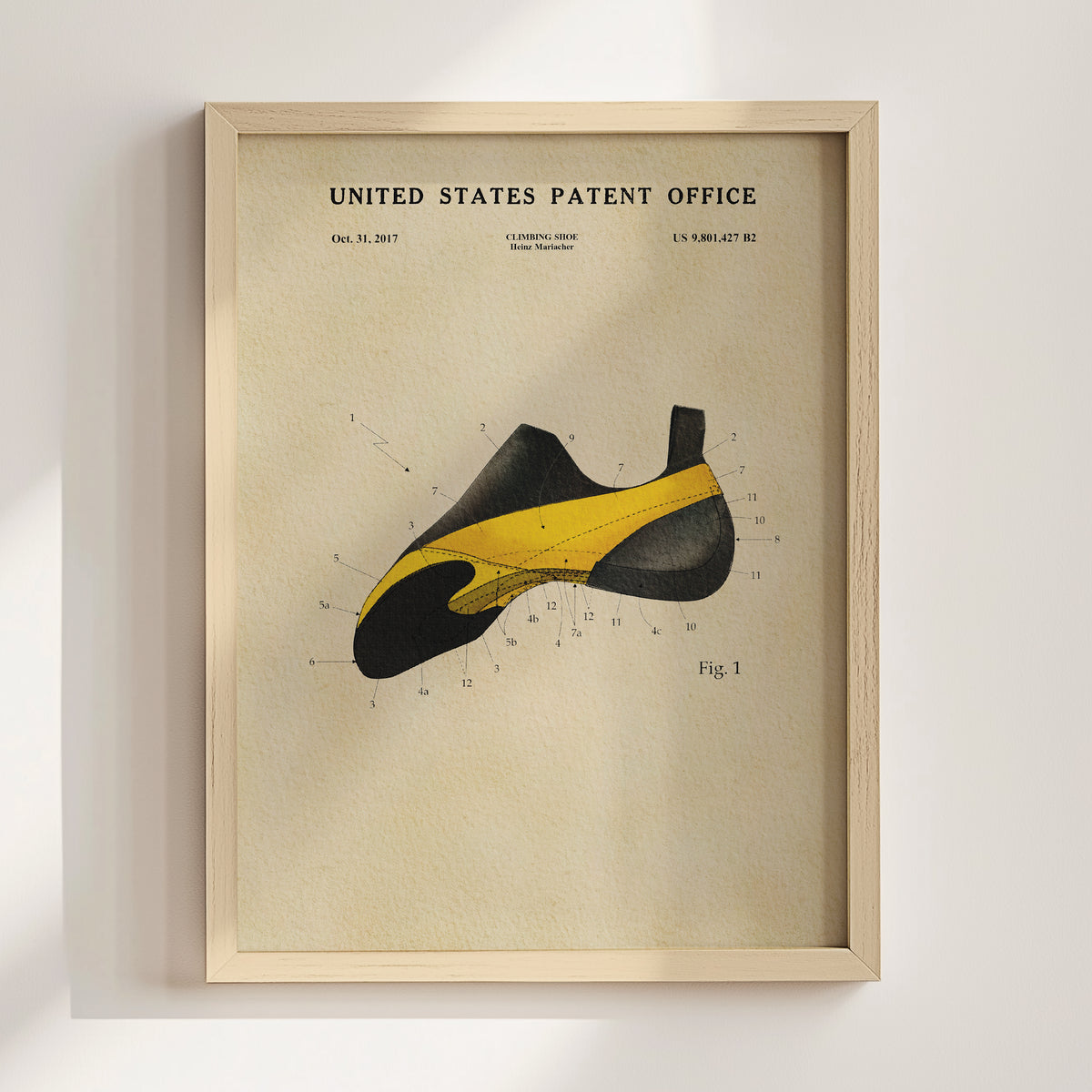 The image is a framed poster or print featuring a detailed illustration of a climbing shoe, along with the text "United States Patent Office" and "Climbing Shoe Patented by Heinz-Müller".