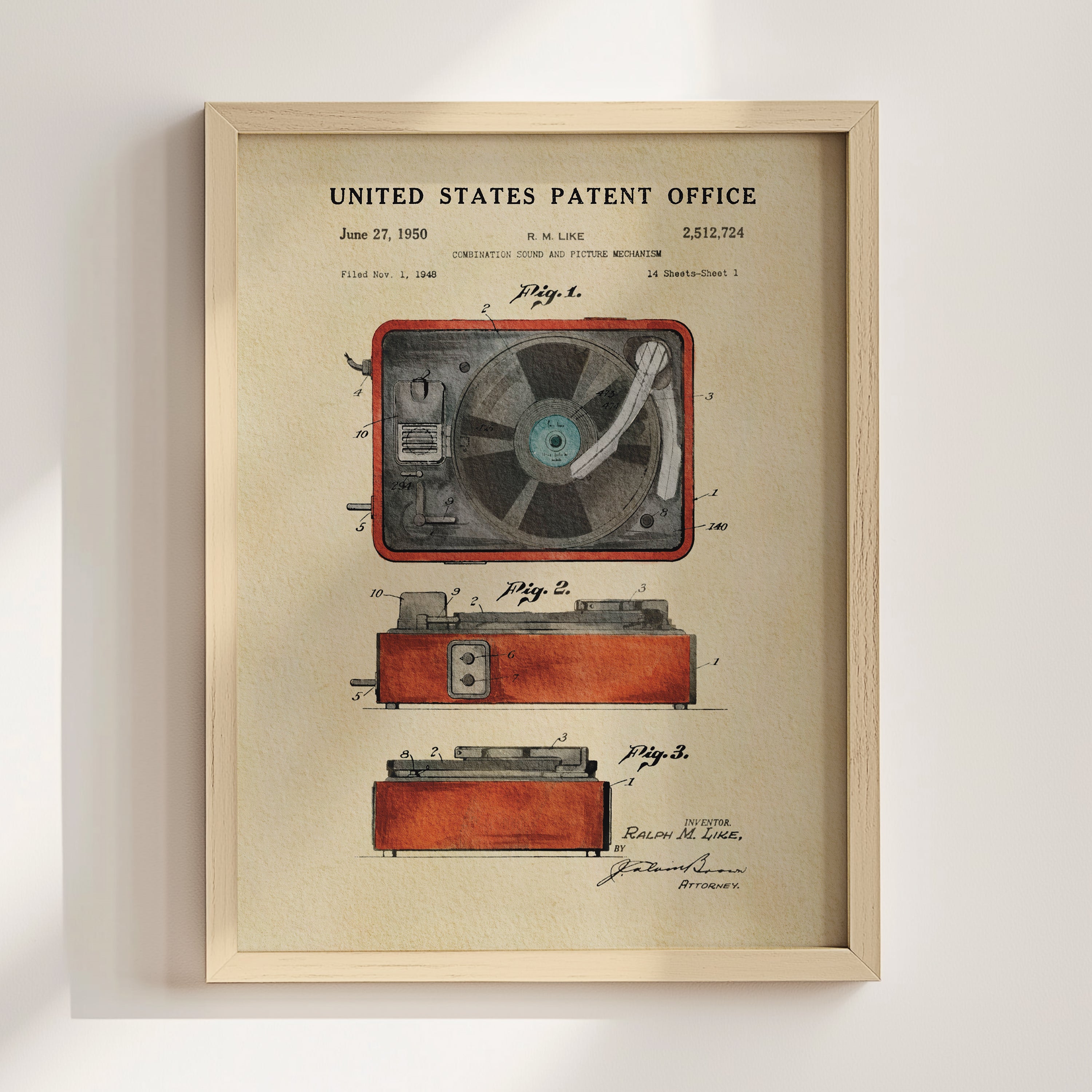 The image is a framed patent drawing depicting a vintage record player, with detailed technical drawings and labels.