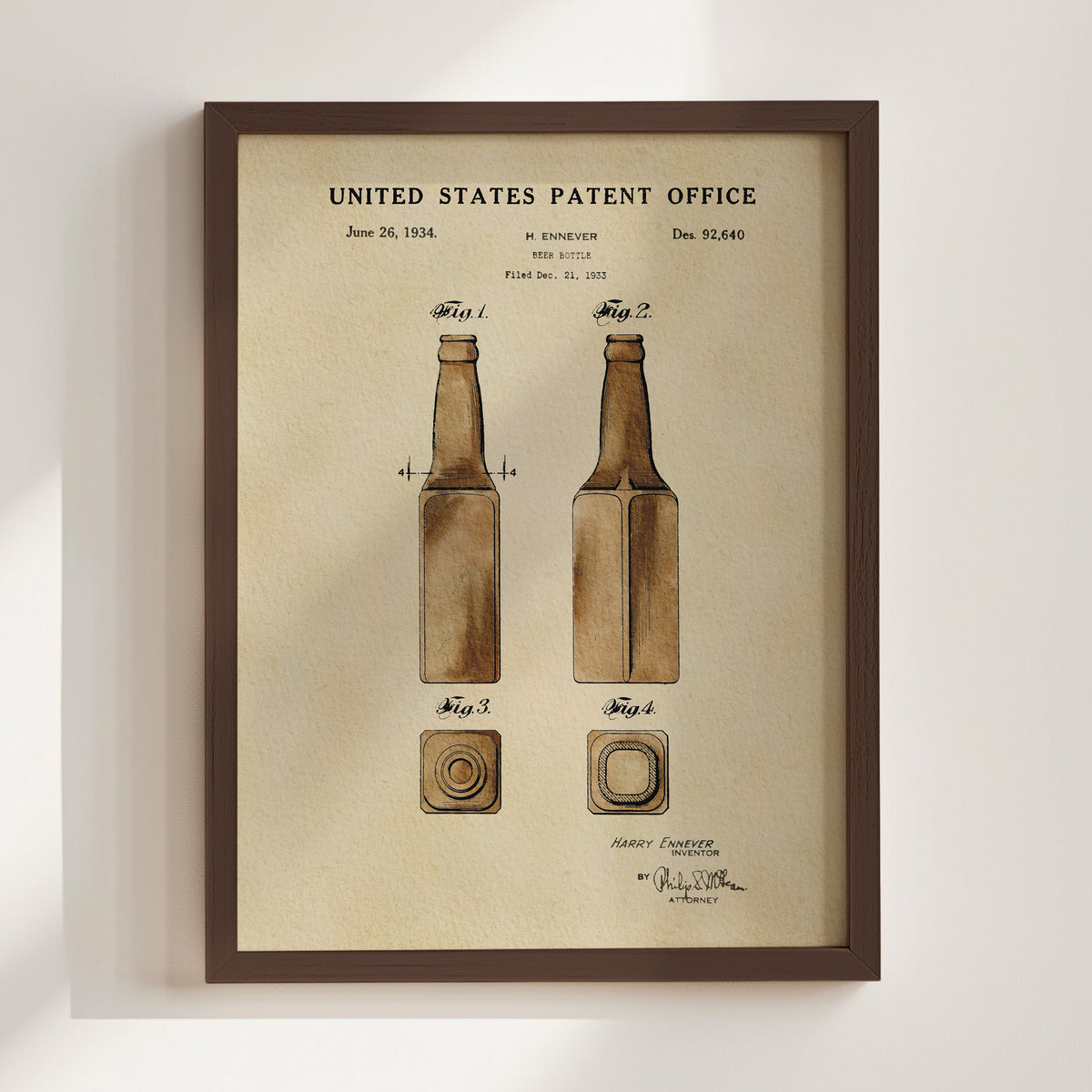 The image is a framed patent drawing depicting two bottles, with the text "United States Patent Office" and "Harvey Ennever" at the top.