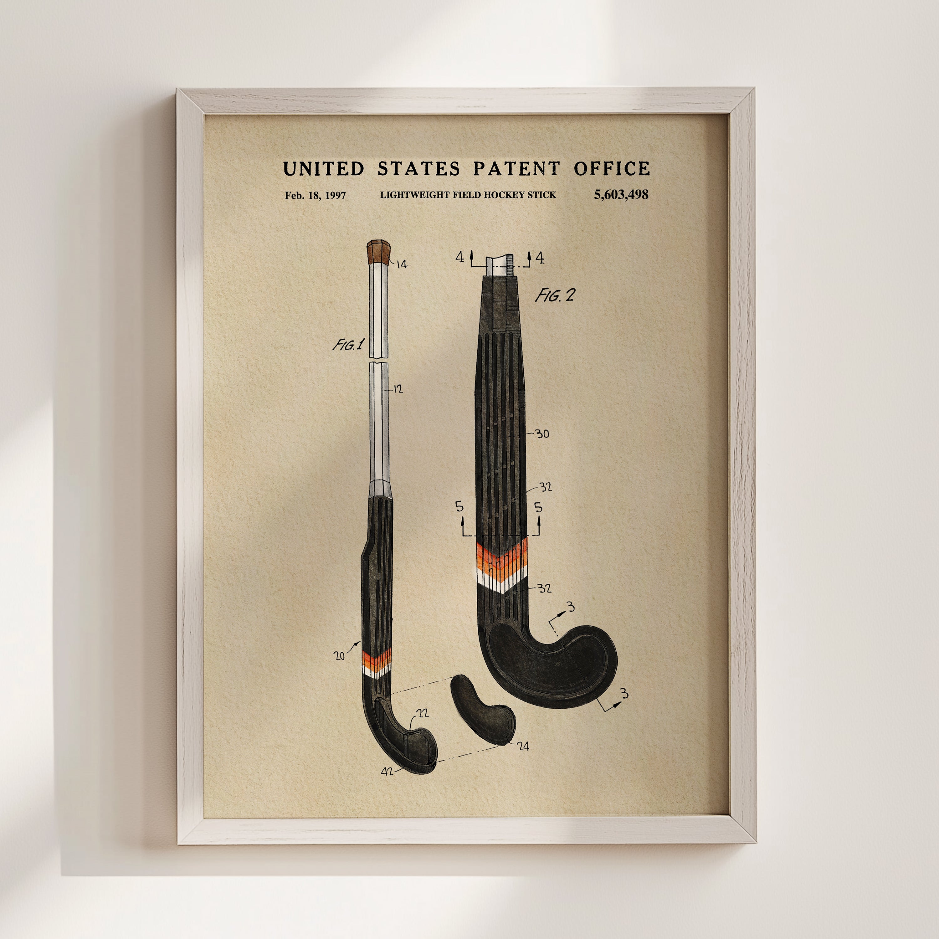 The image is a framed patent drawing depicting a hockey stick with various technical drawings and measurements.