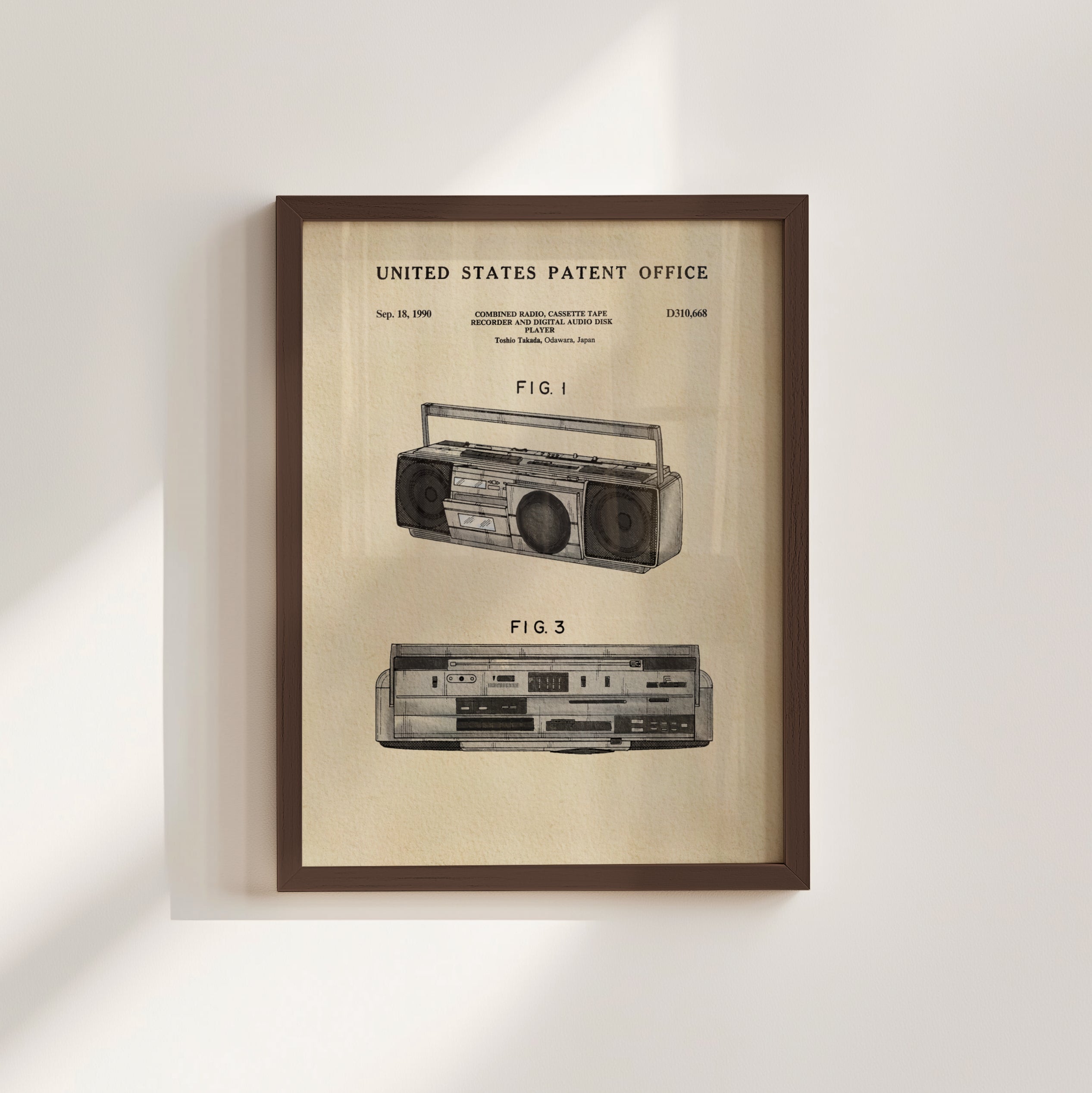 The image is a framed patent drawing of a boombox, depicting the design and features of the device.