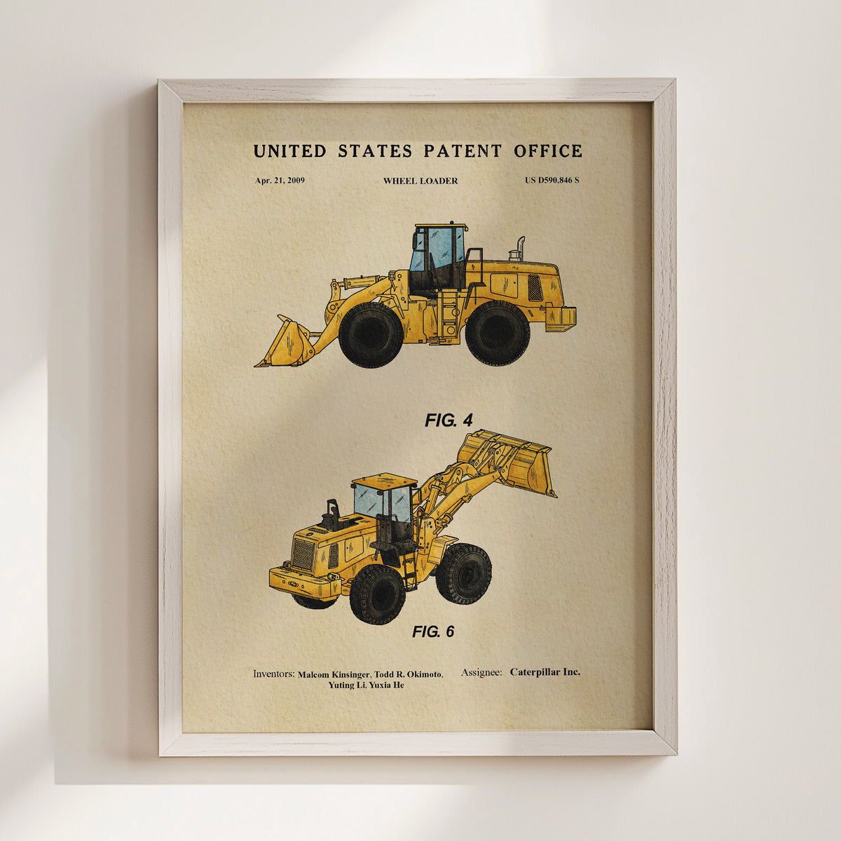 The image is a framed illustration of two yellow wheel loaders, labeled as "Fig. 4" and "Fig. 6", with the United States Patent Office and the date April 21, 2009, printed on the top.