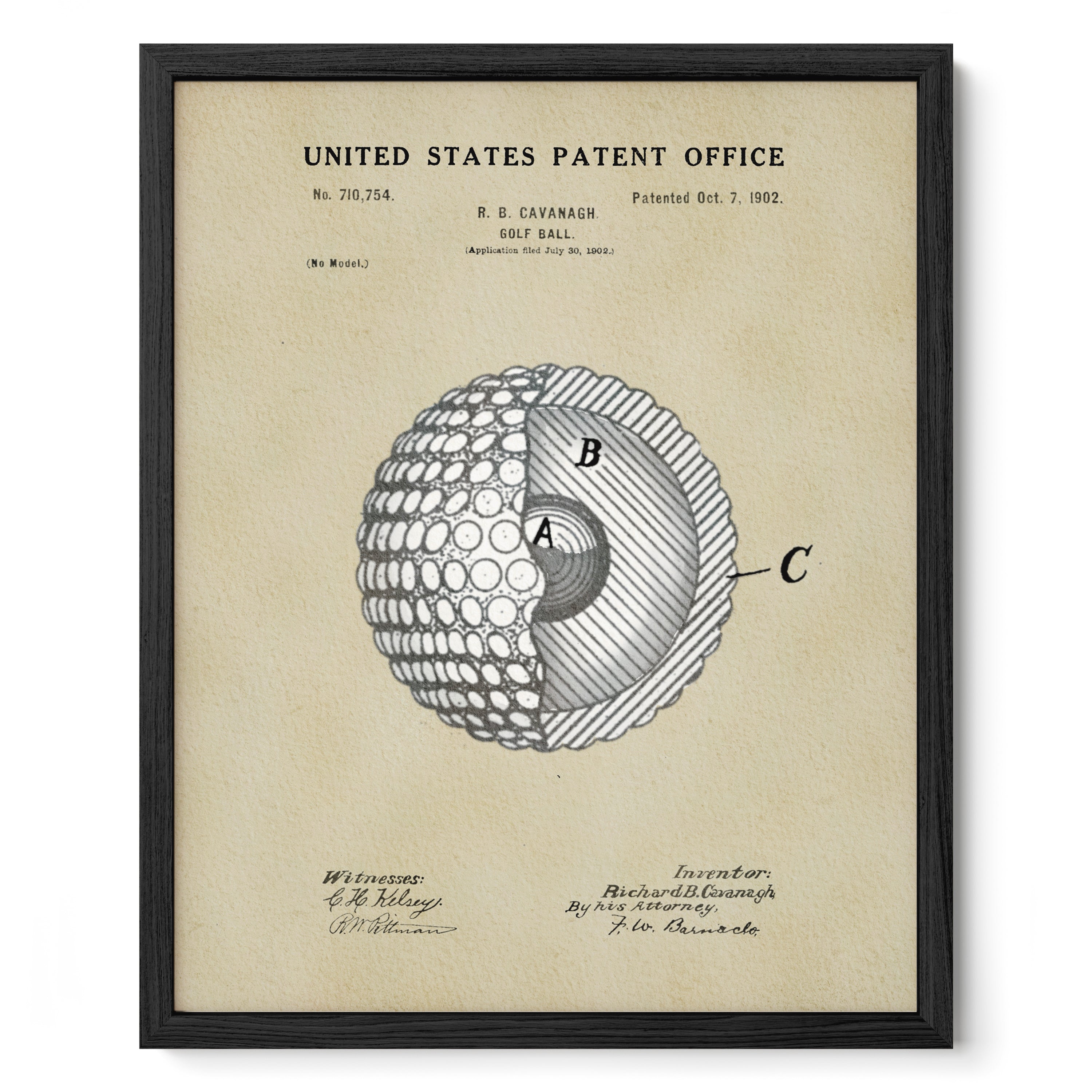 The image is a framed print of a United States patent office patent from 1902, featuring a detailed drawing of a golf ball with a cross-section diagram.