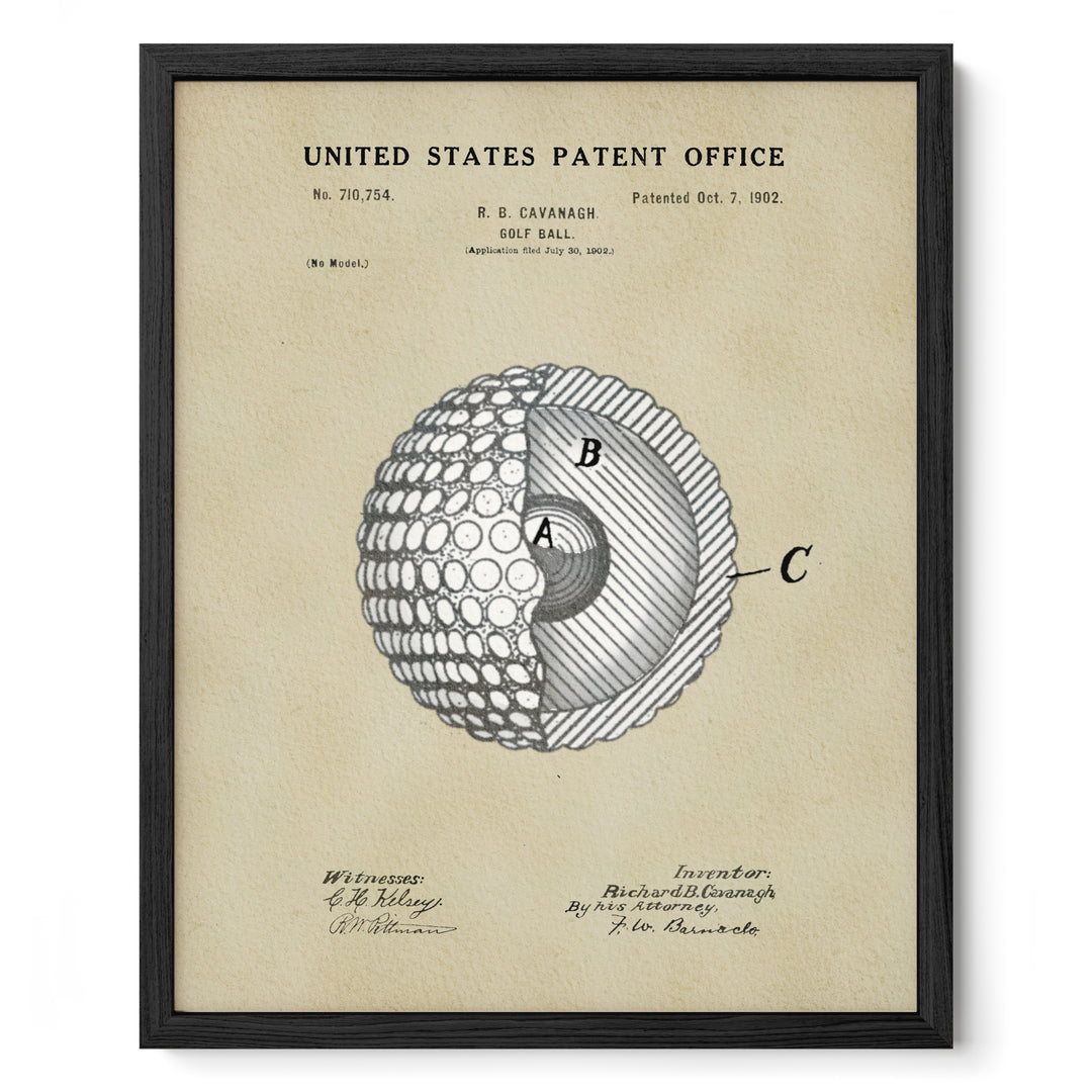 The image is a framed print of a United States patent office patent from 1902, featuring a detailed drawing of a golf ball with a cross-section diagram.
