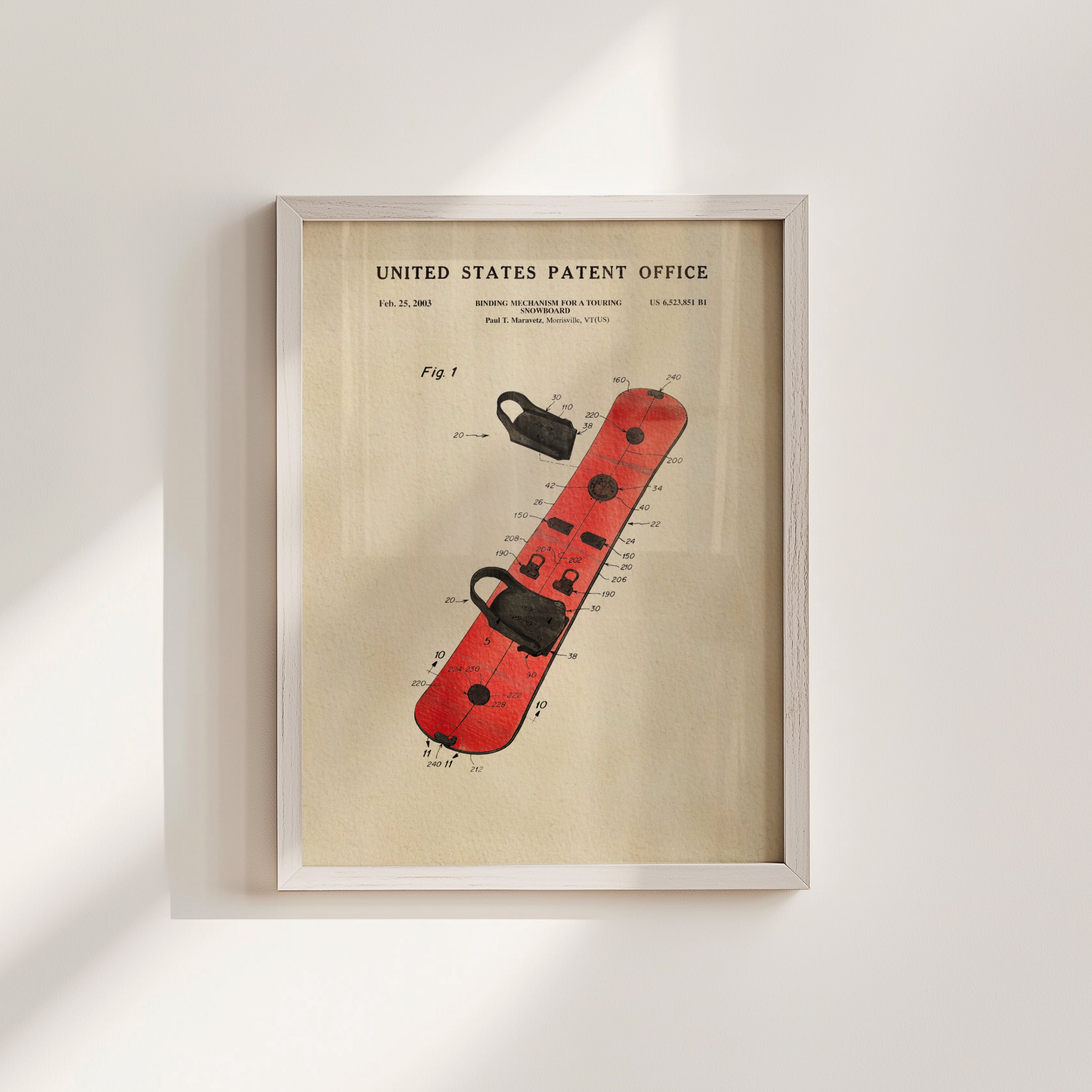 The image is a framed patent drawing of a red snowboard with various technical drawings and text.