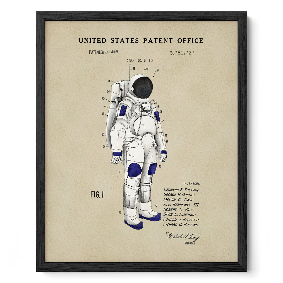 The image is a framed print depicting a detailed illustration of an astronaut's spacesuit, with various technical drawings and labels.