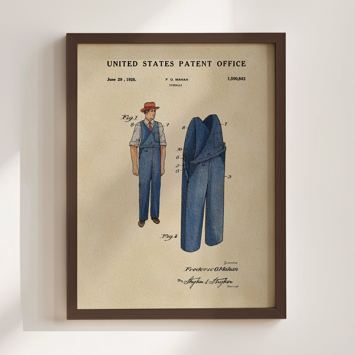 The image is a framed patent drawing depicting a man wearing a red hat and blue overalls, with a pair of blue jeans visible.