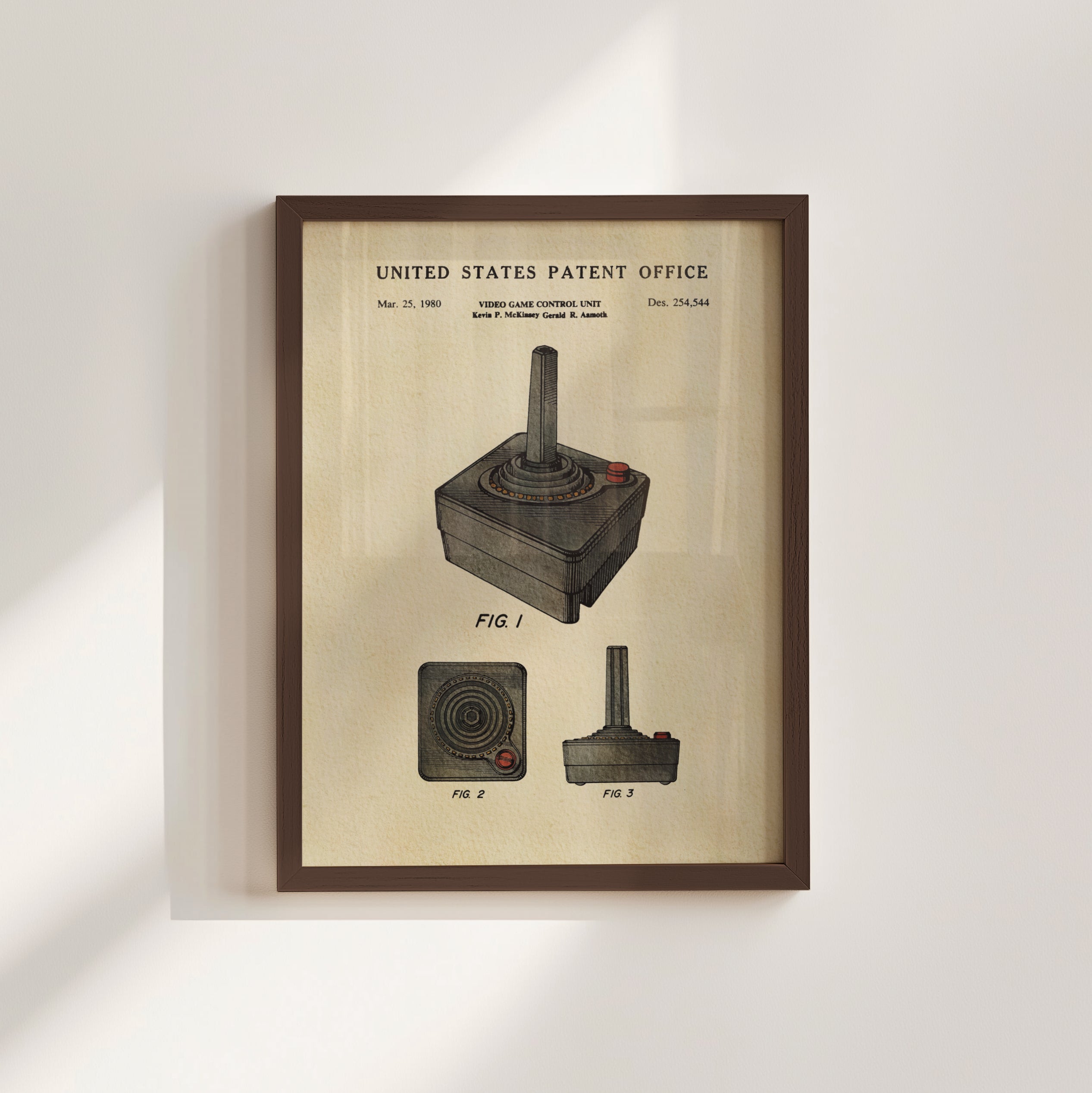 The image is a framed patent drawing of a joystick, depicting the joystick in three different views.