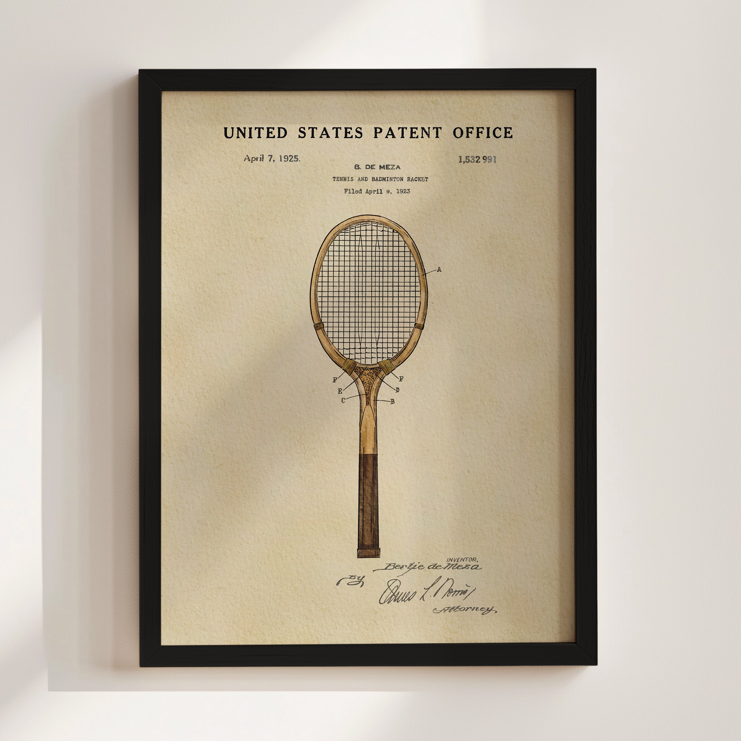 The image is a framed vintage patent drawing of a tennis racket, depicting a design from the early 20th century.
