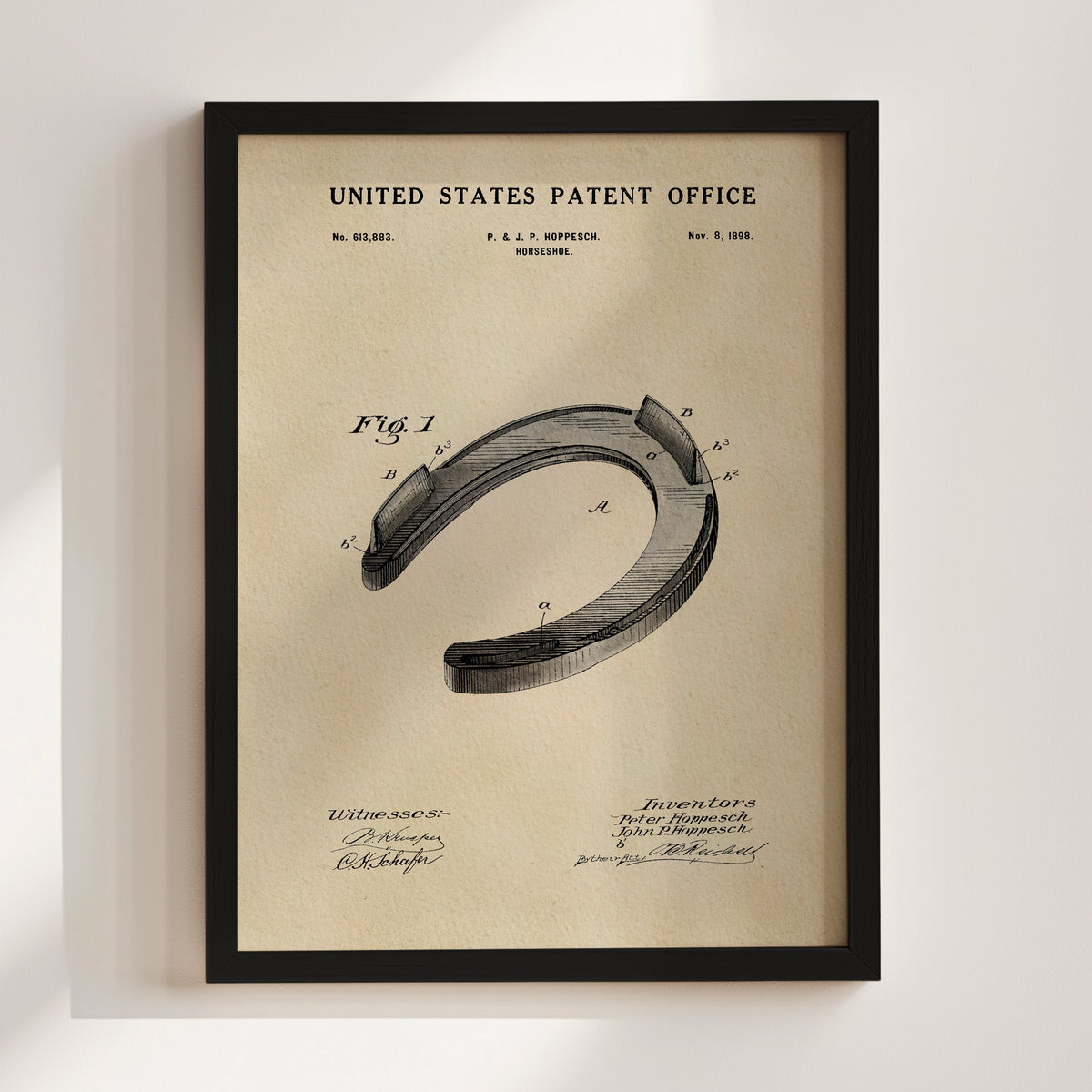 The image is a framed vintage patent drawing of a horseshoe, depicting the design and construction of the horseshoe.