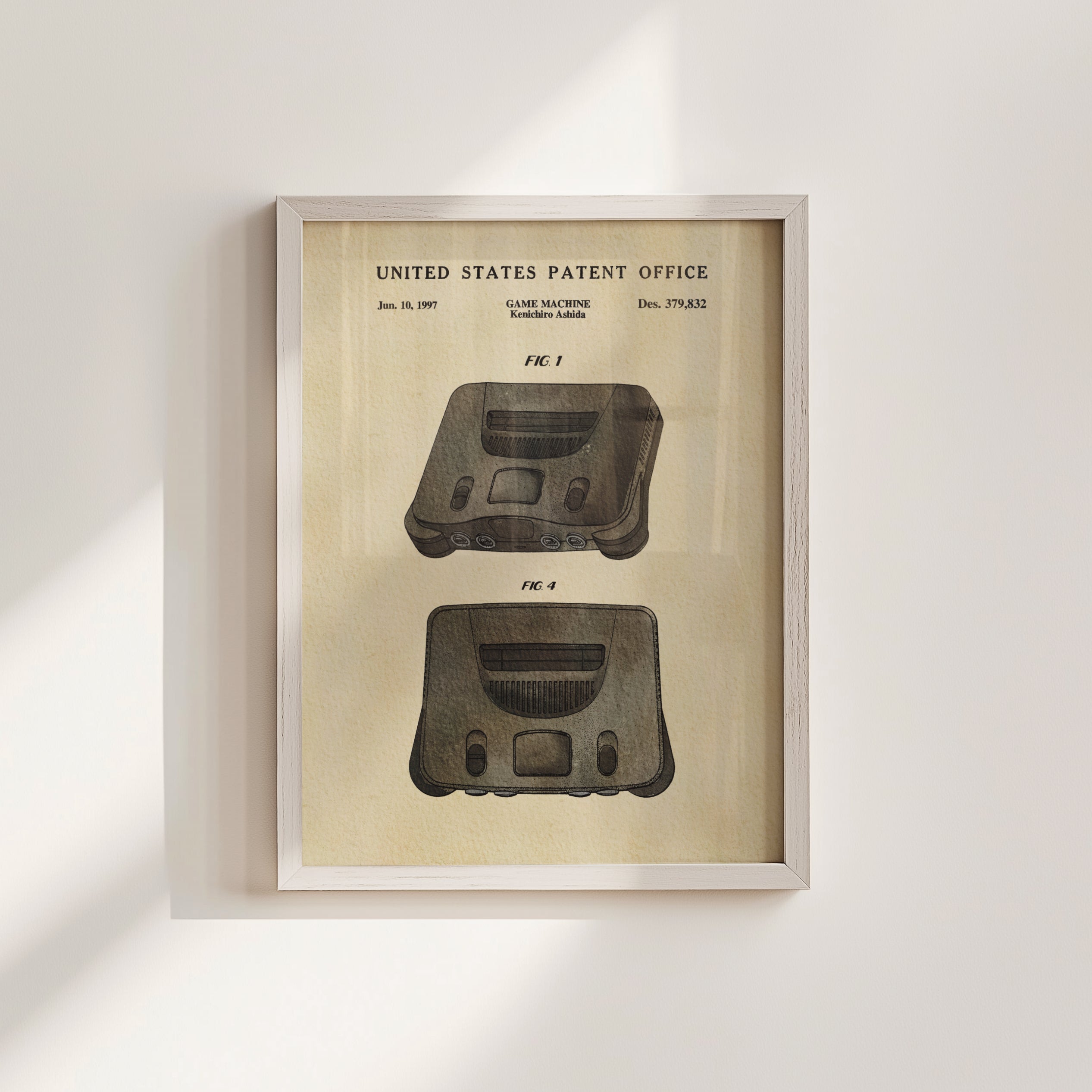 The image is a framed patent drawing of a console machine, specifically a Nintendo 64 console, with a title 