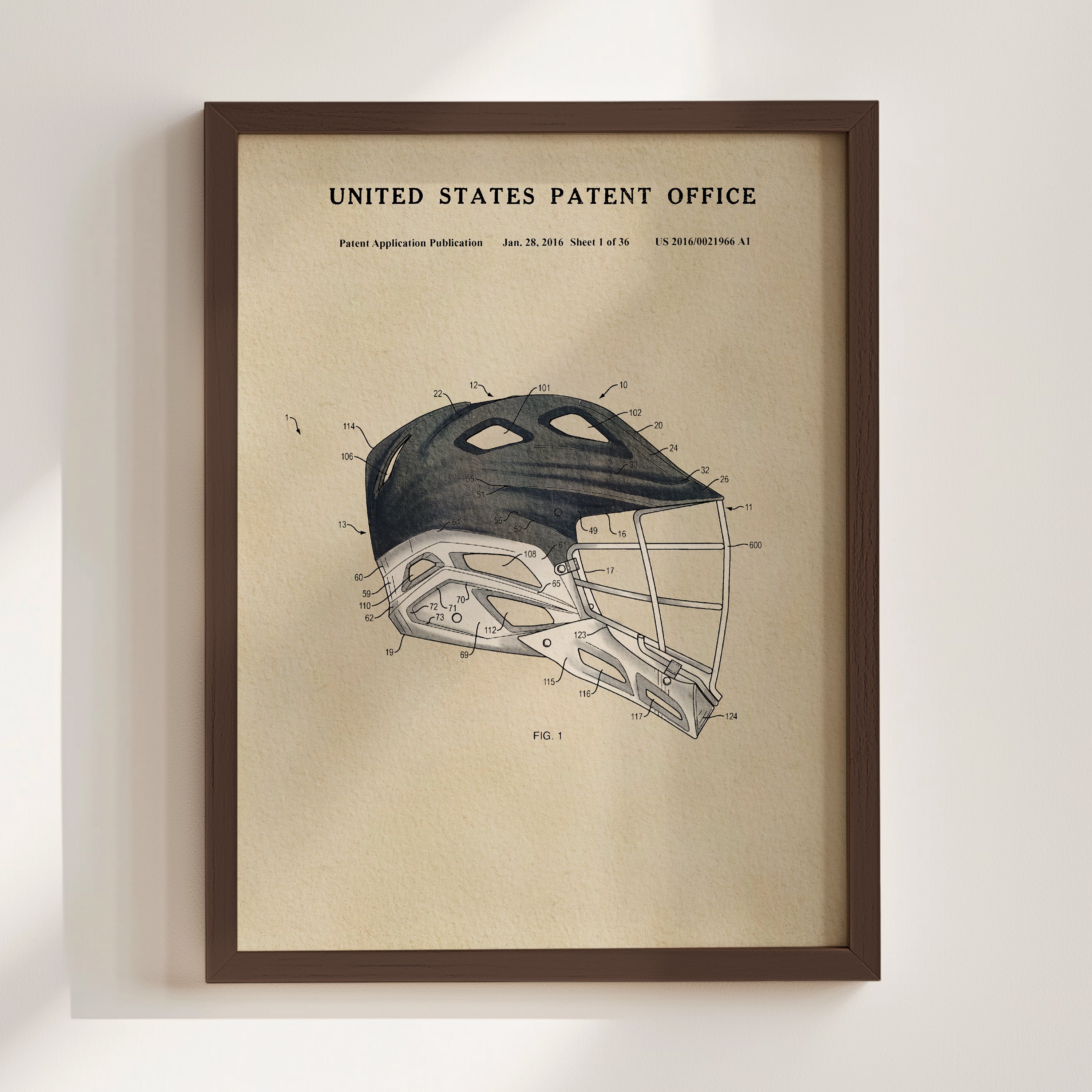 The image is a framed print of a technical drawing or patent application for a sports helmet, specifically a lacrosse helmet.
