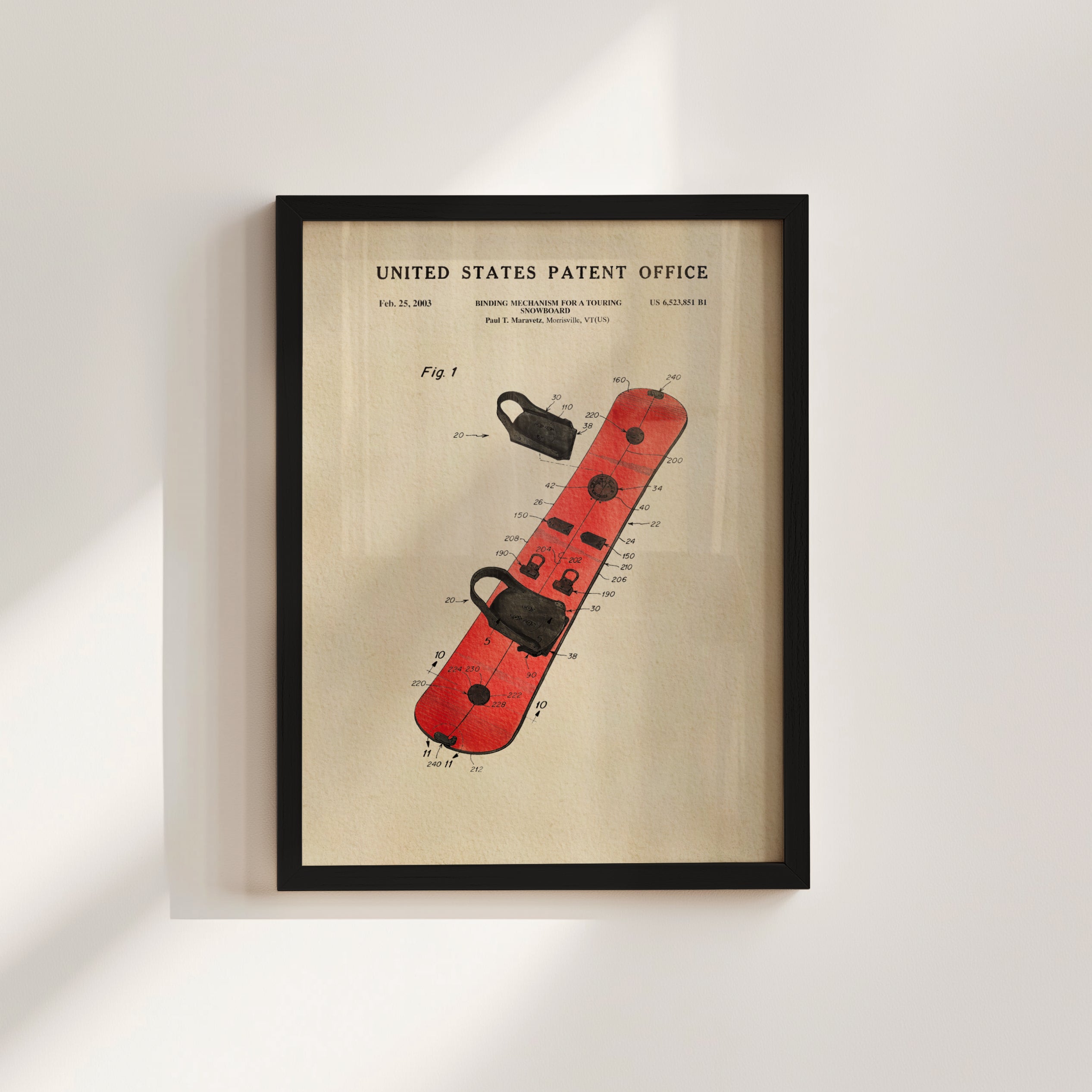 The image is a framed patent drawing of a red snowboard with various technical drawings and text.