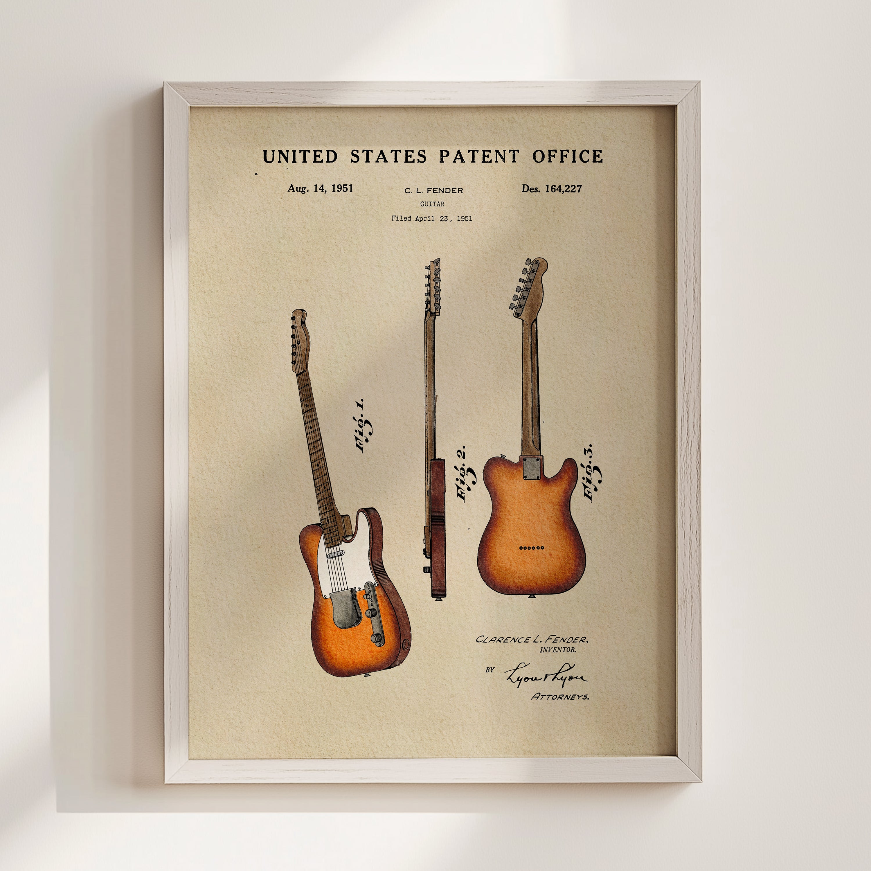 The image is a framed print of a patent filing from the United States Patent Office, featuring three electric guitars.