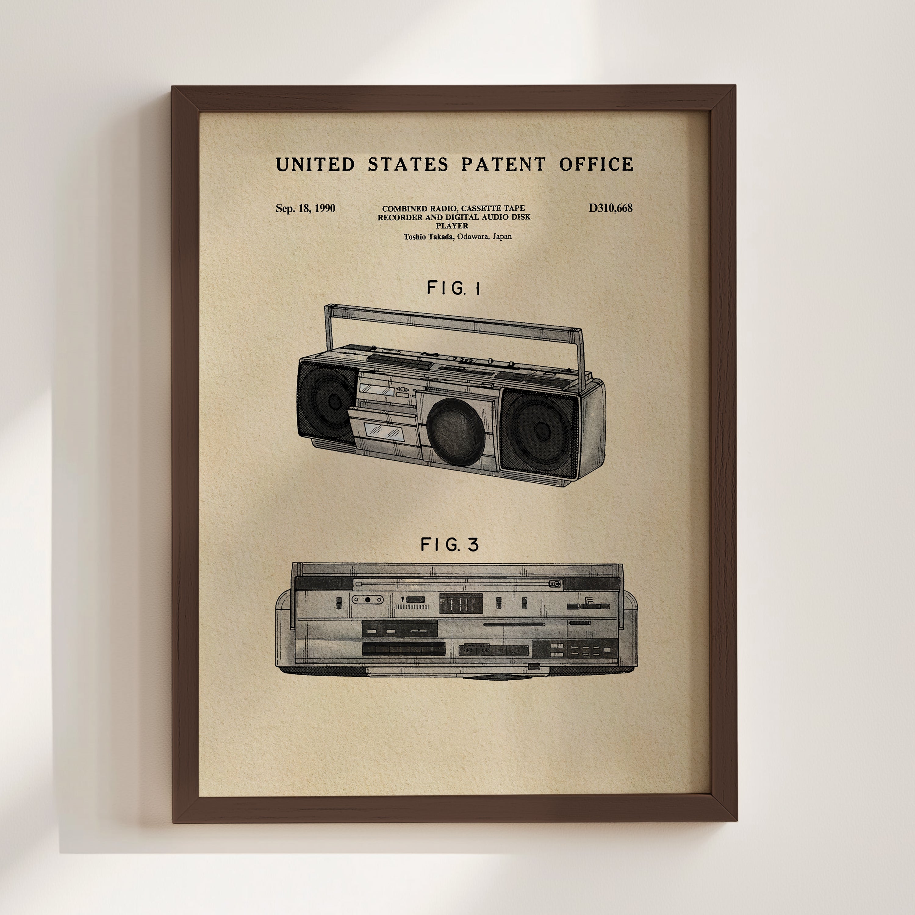 The image is a framed patent drawing of a boombox, depicting the design and features of the device.