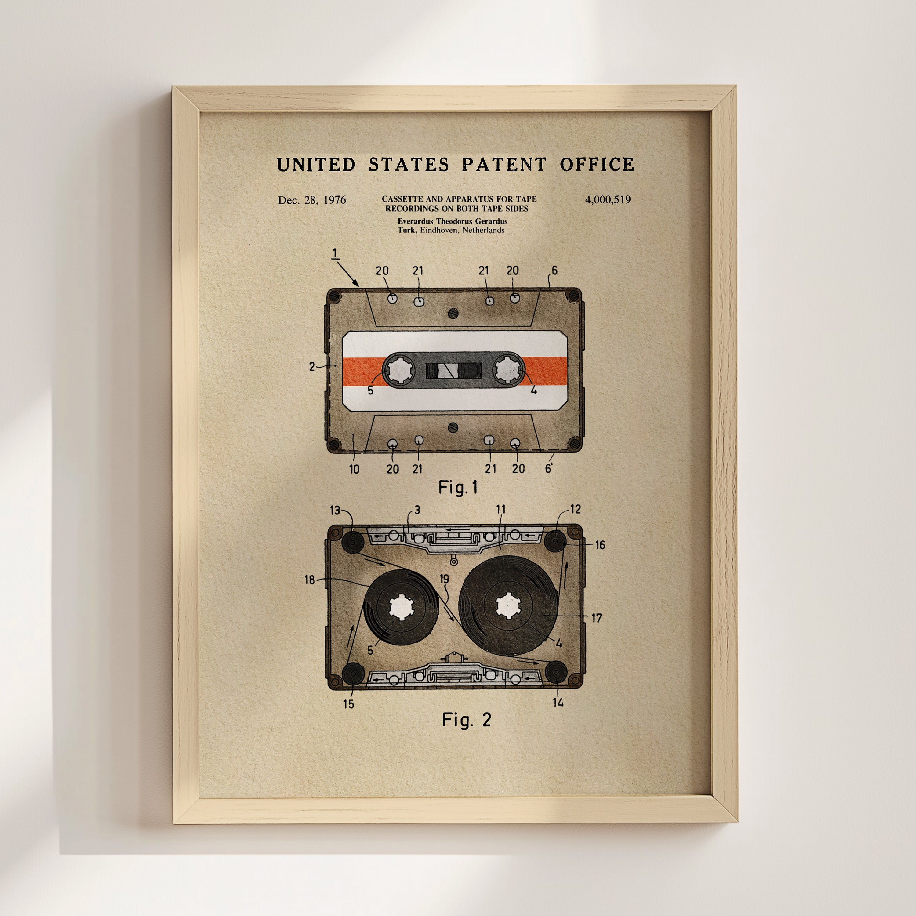 The image is a framed patent drawing depicting a cassette tape and a tape recorder, both with a focus on their technical details.